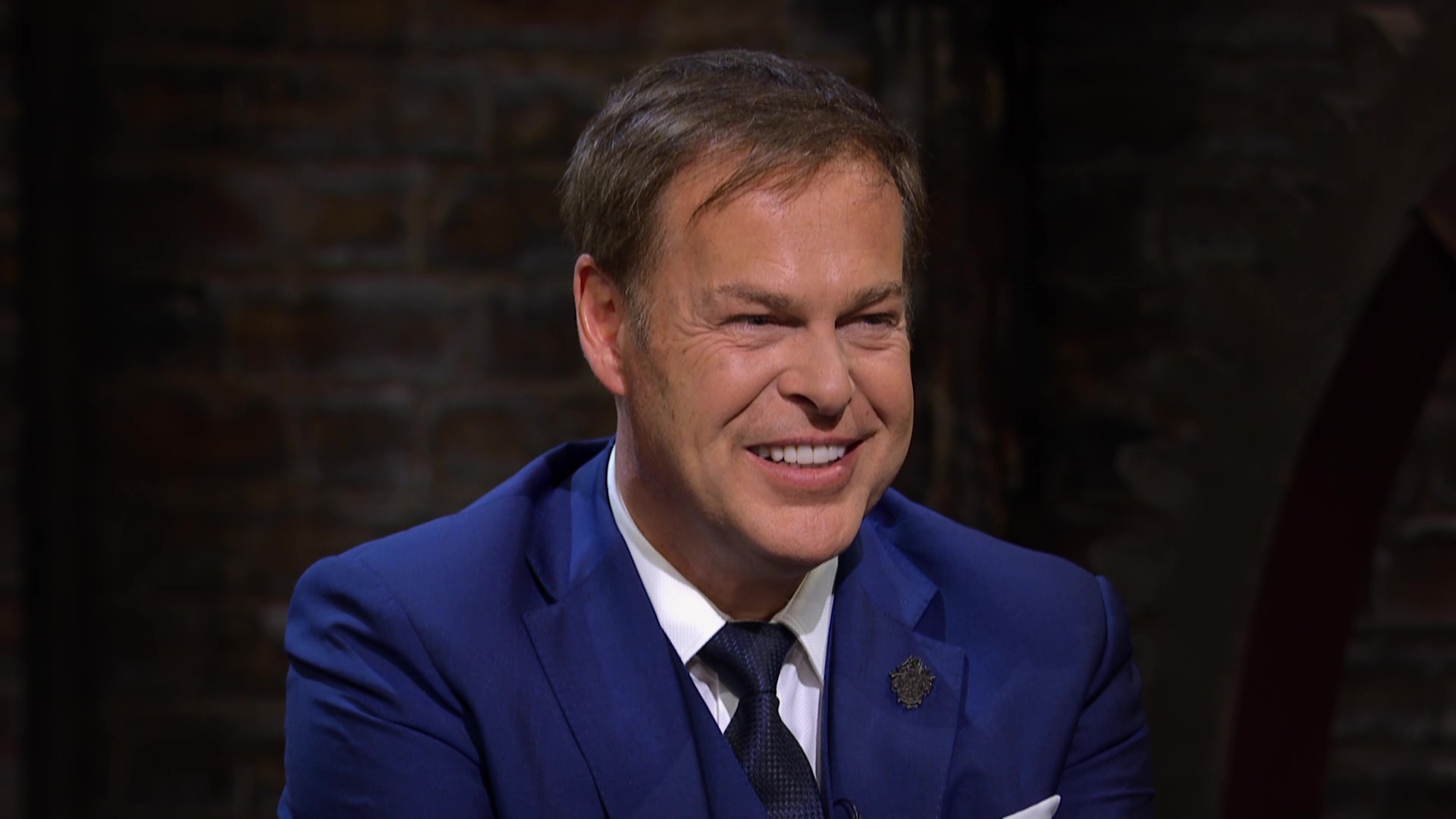 Peter Jones smiles during a pitch in Dragons' Den episode 7