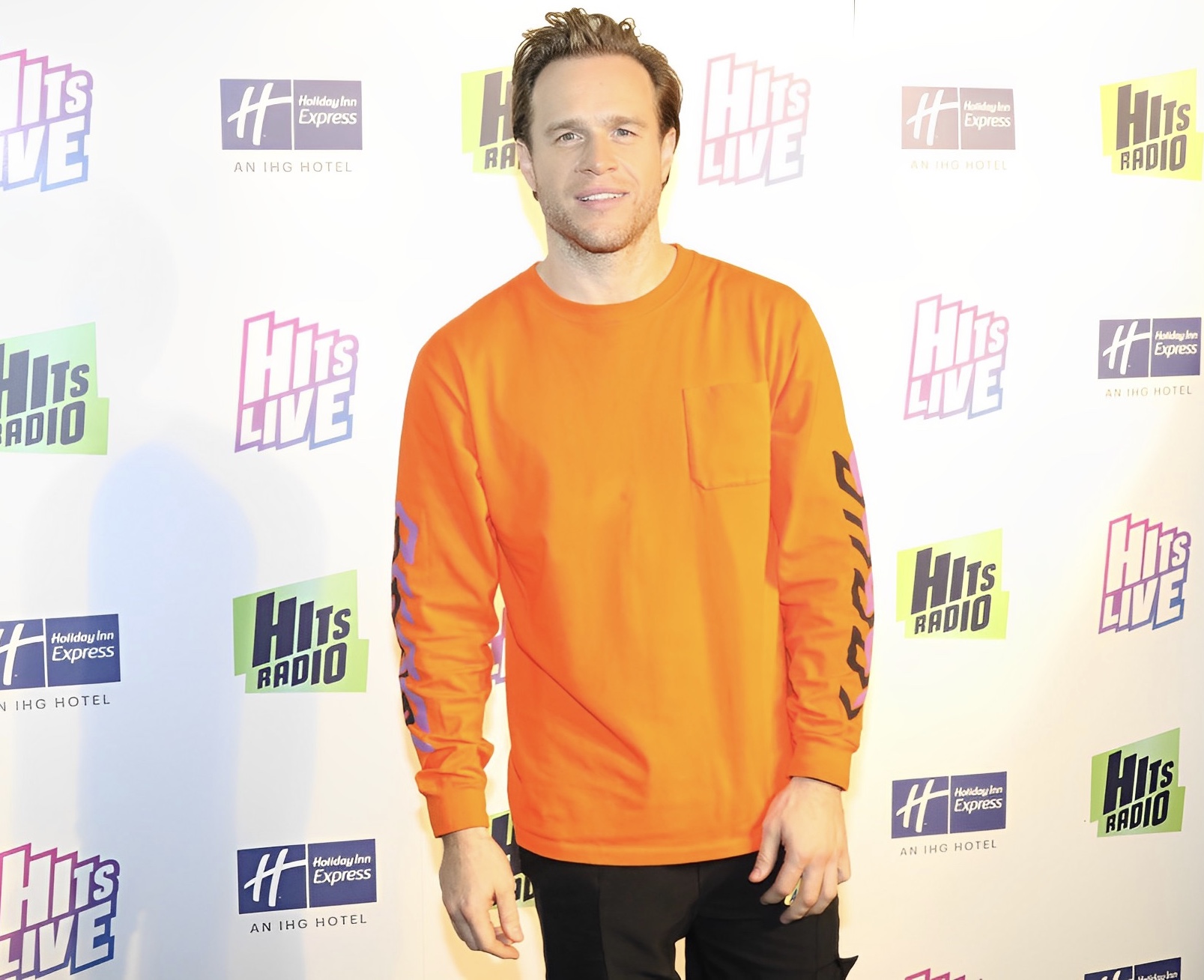 Olly Murs posing fo photos