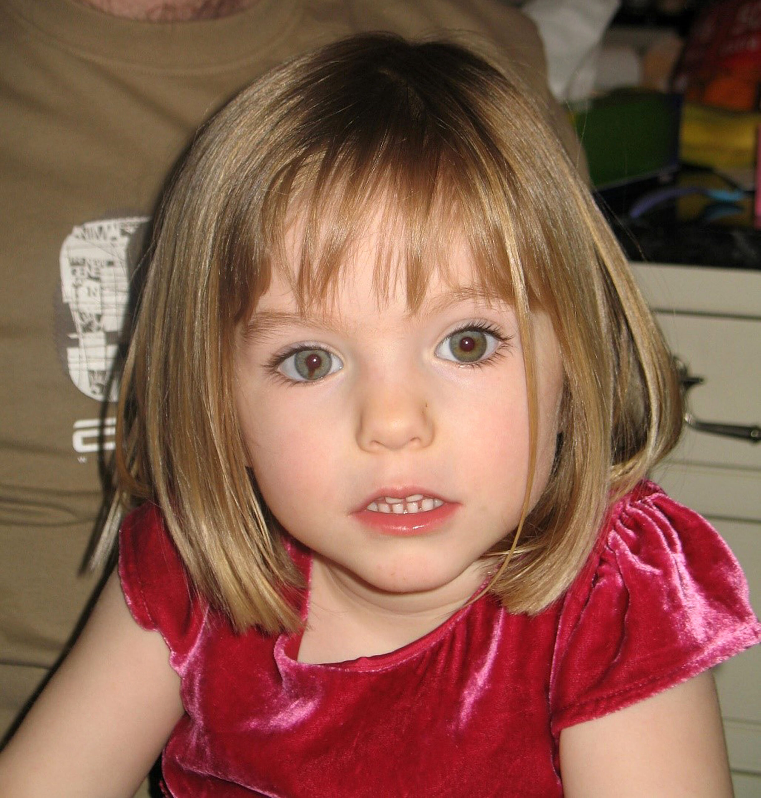Madeleine McCann wearing a red dress