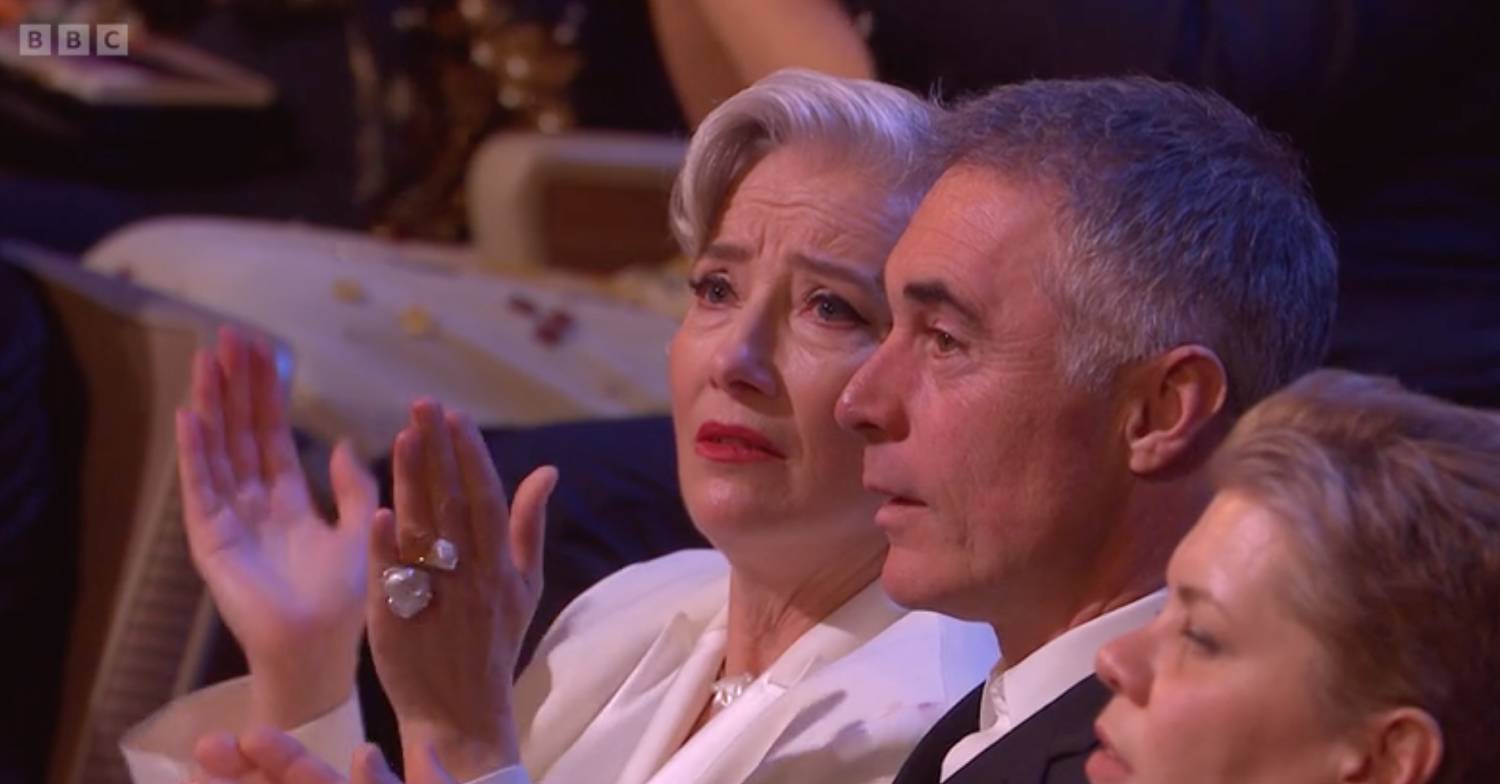 Emma Thompson sits with Greg Wise and appears emotional following BAFTAs 2023 In Memoriam segment
