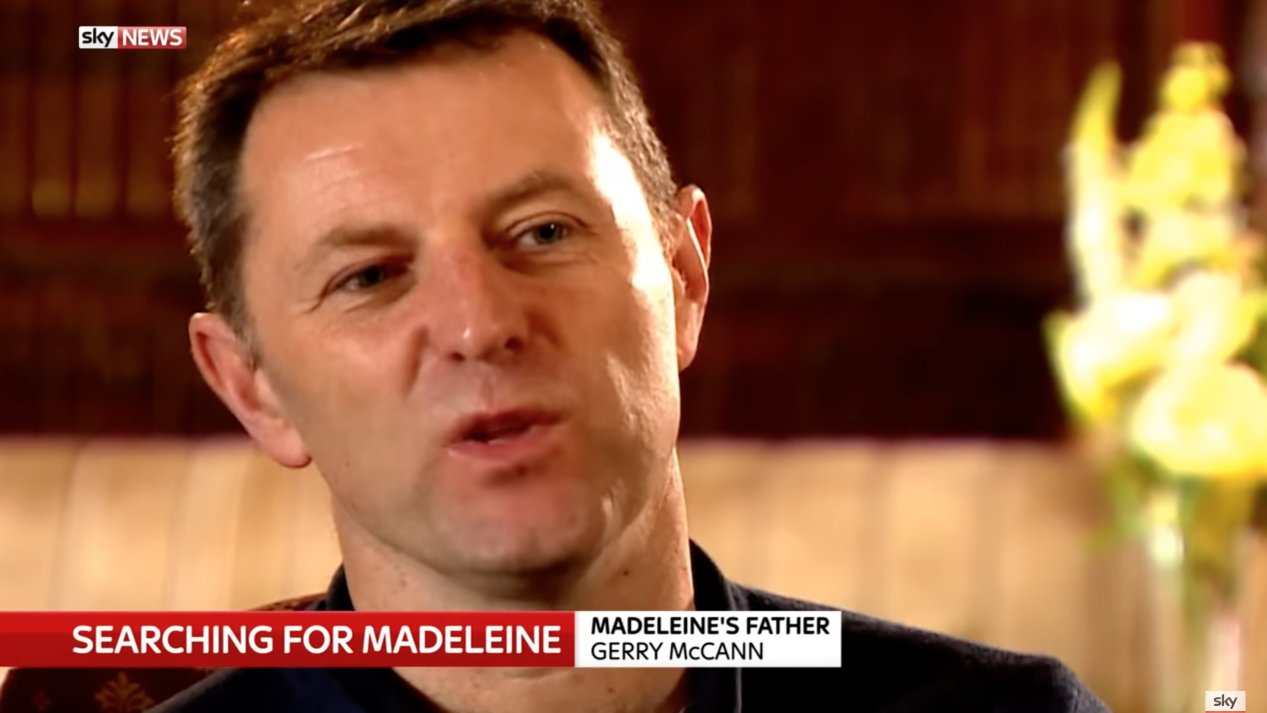 Gerry McCann looking pained in a TV interview