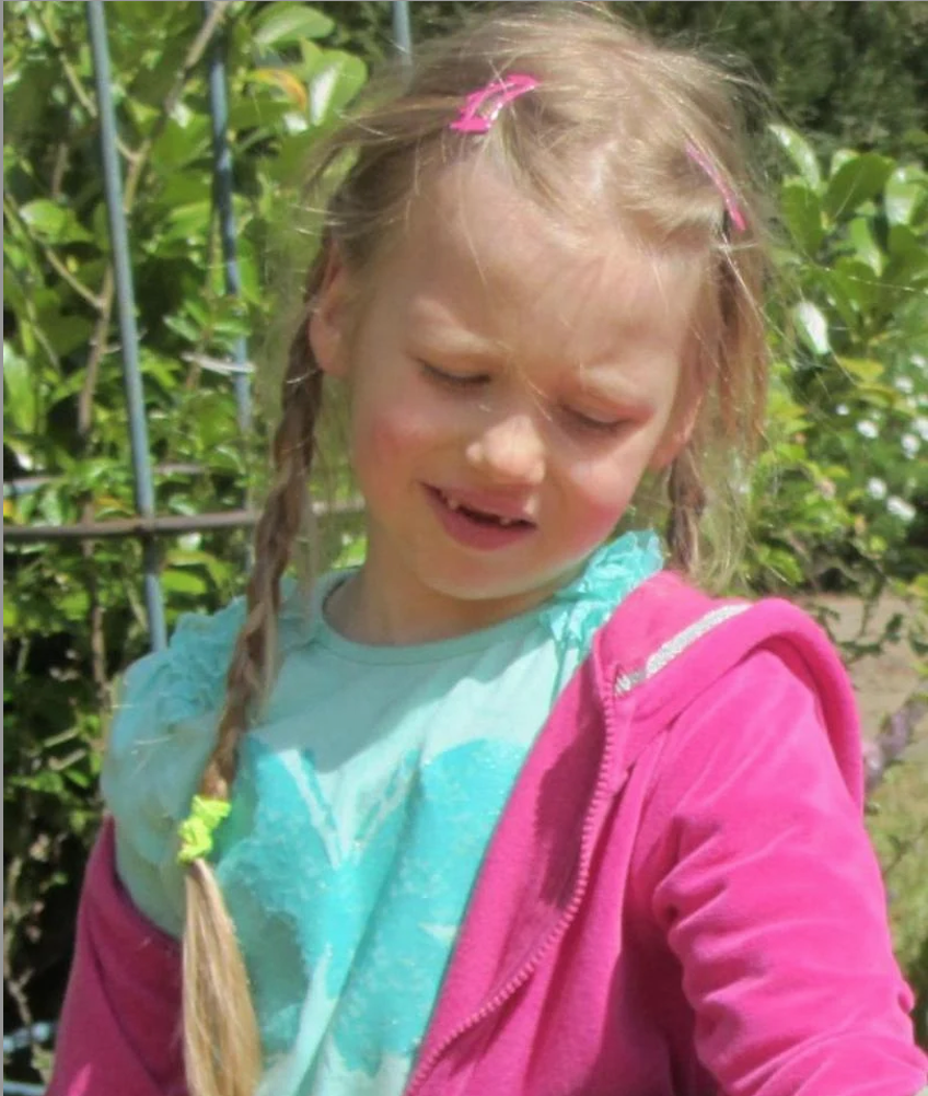 Missing girl Inga wearing a pink hoodie