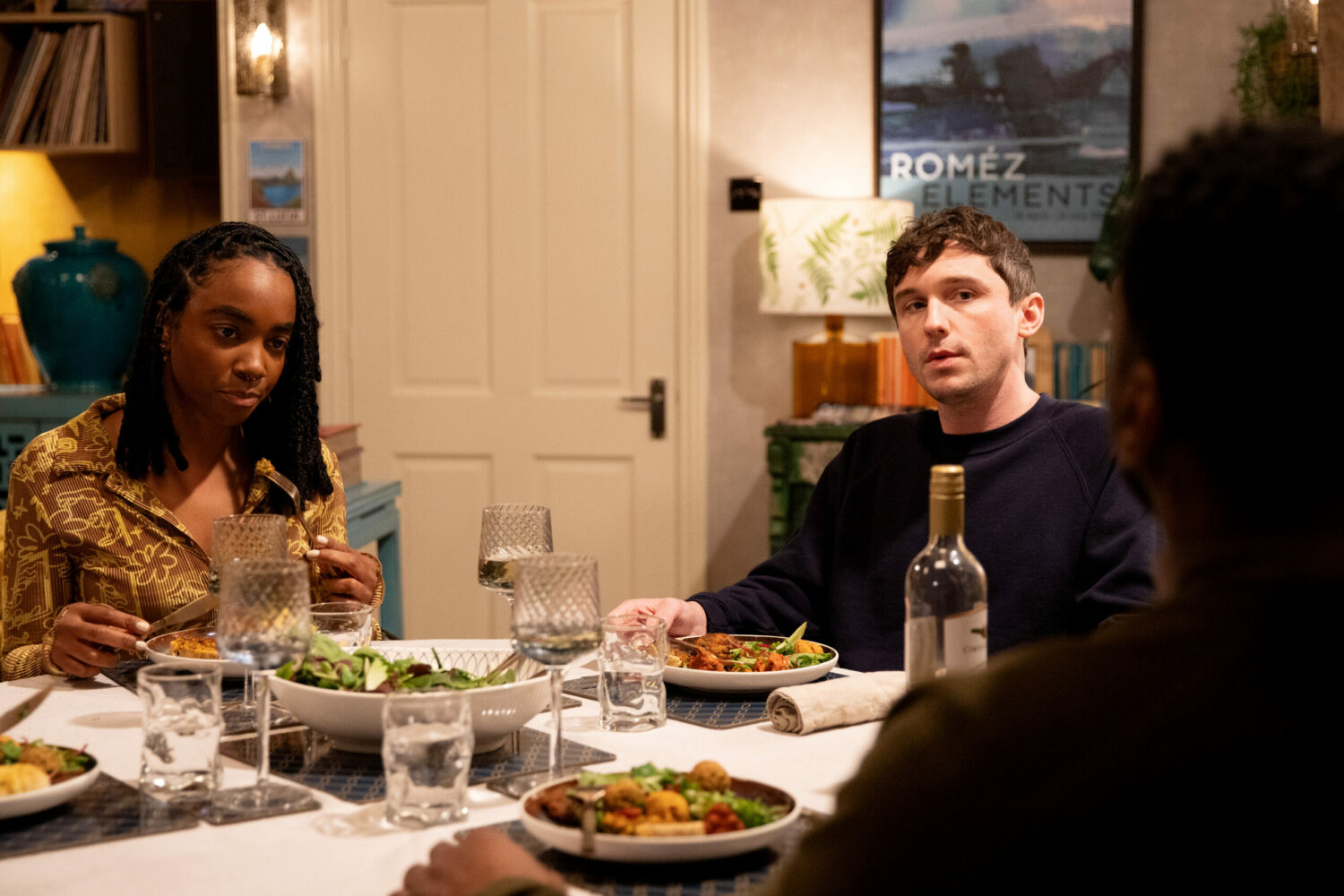 Naomi and Alex look suspiciously at Charles over lunch in Emmerdale 
