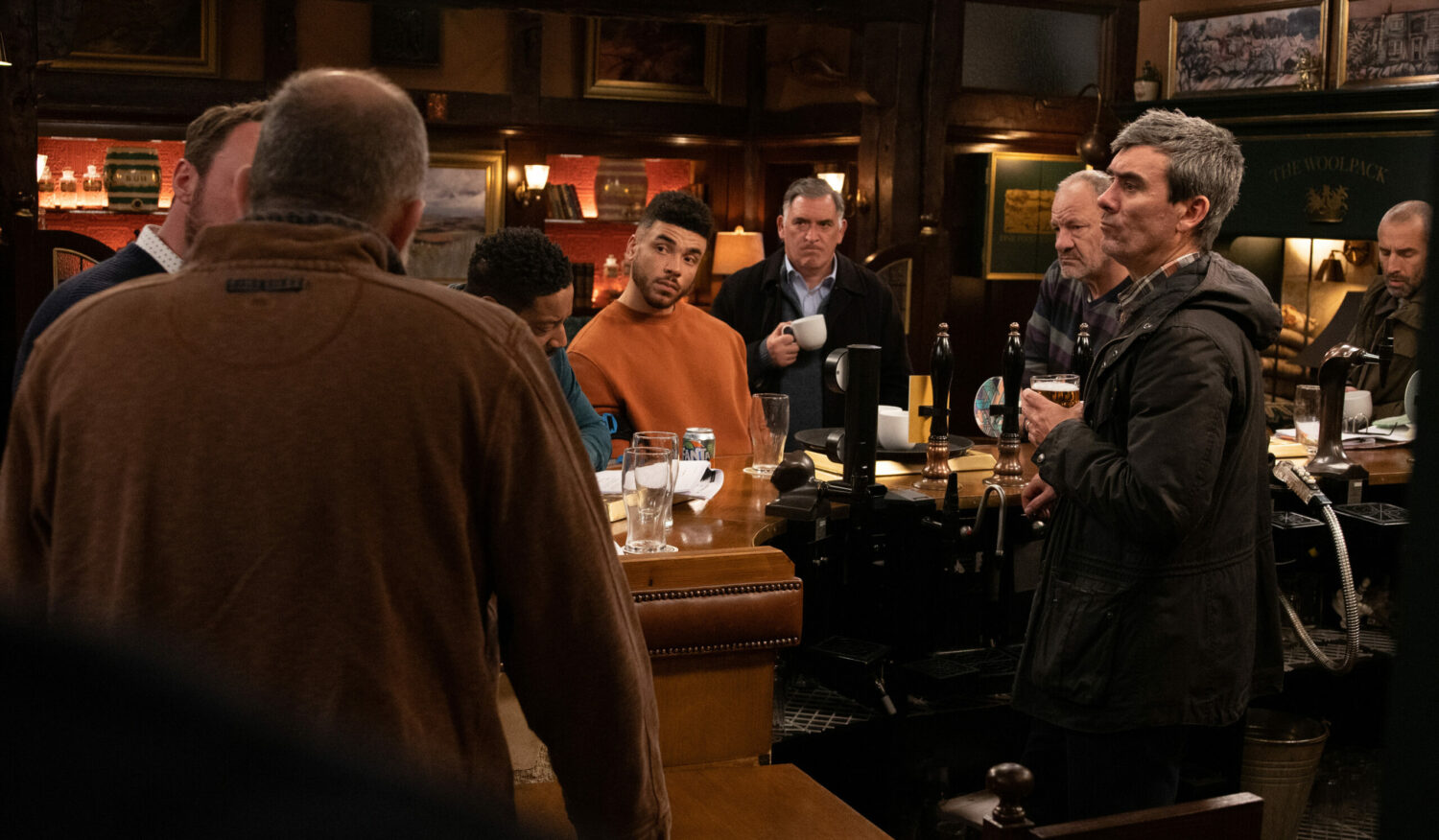The men gathered at the bar on Emmerdale