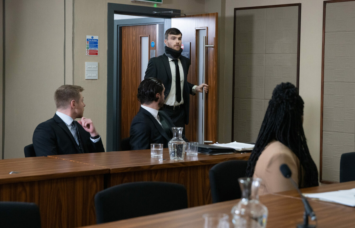 Justin enters the courtroom on Coronation Street