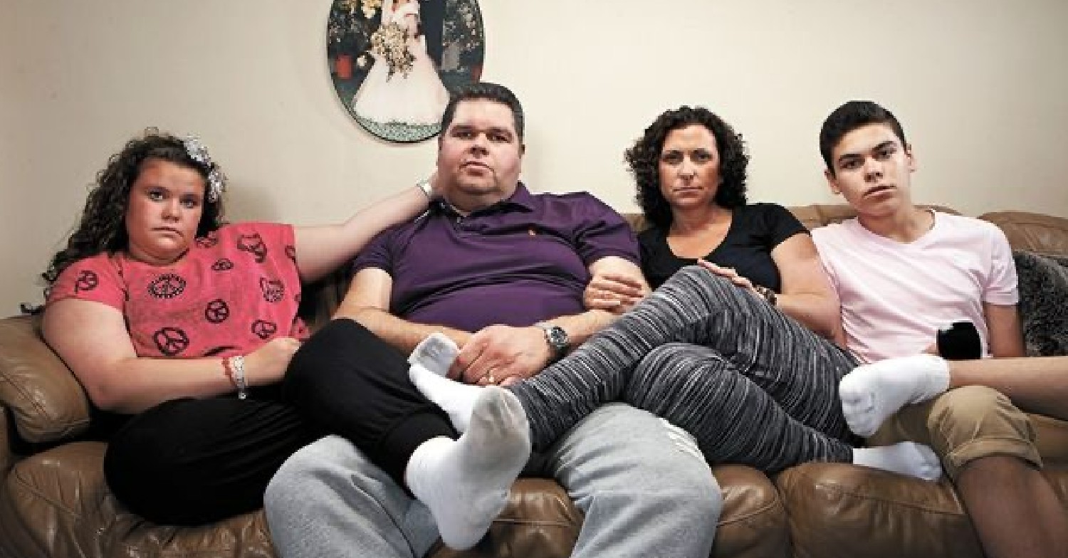 The Tapper family sitting on their sofa