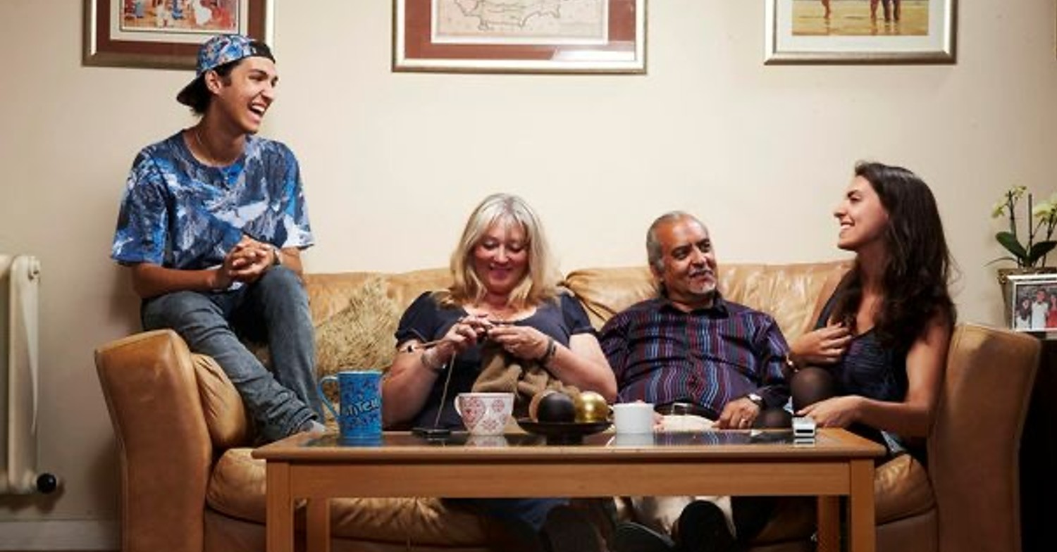 The Michaels family sitting on the sofa