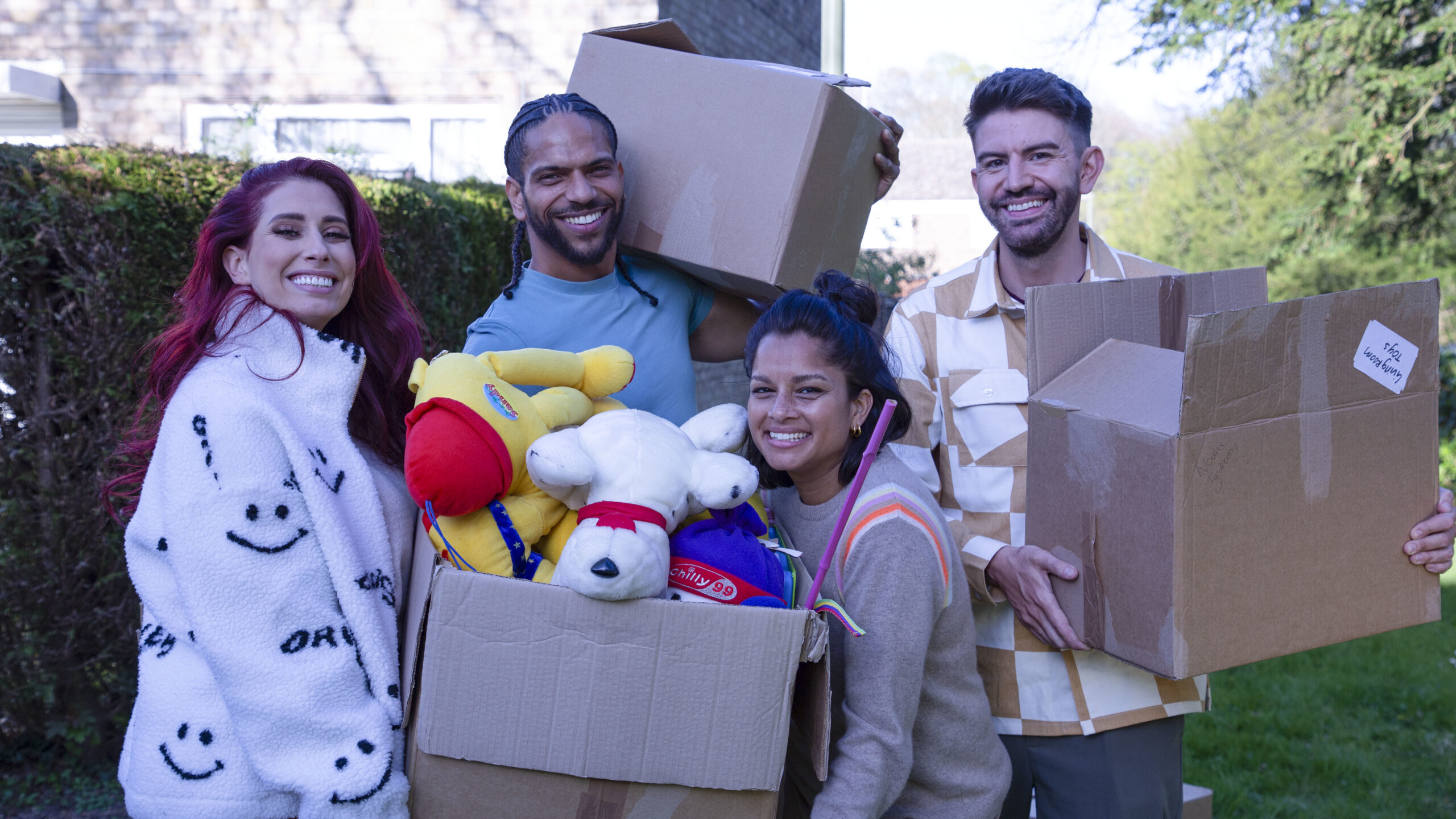 The Sort Your Life Out team pose with boxes