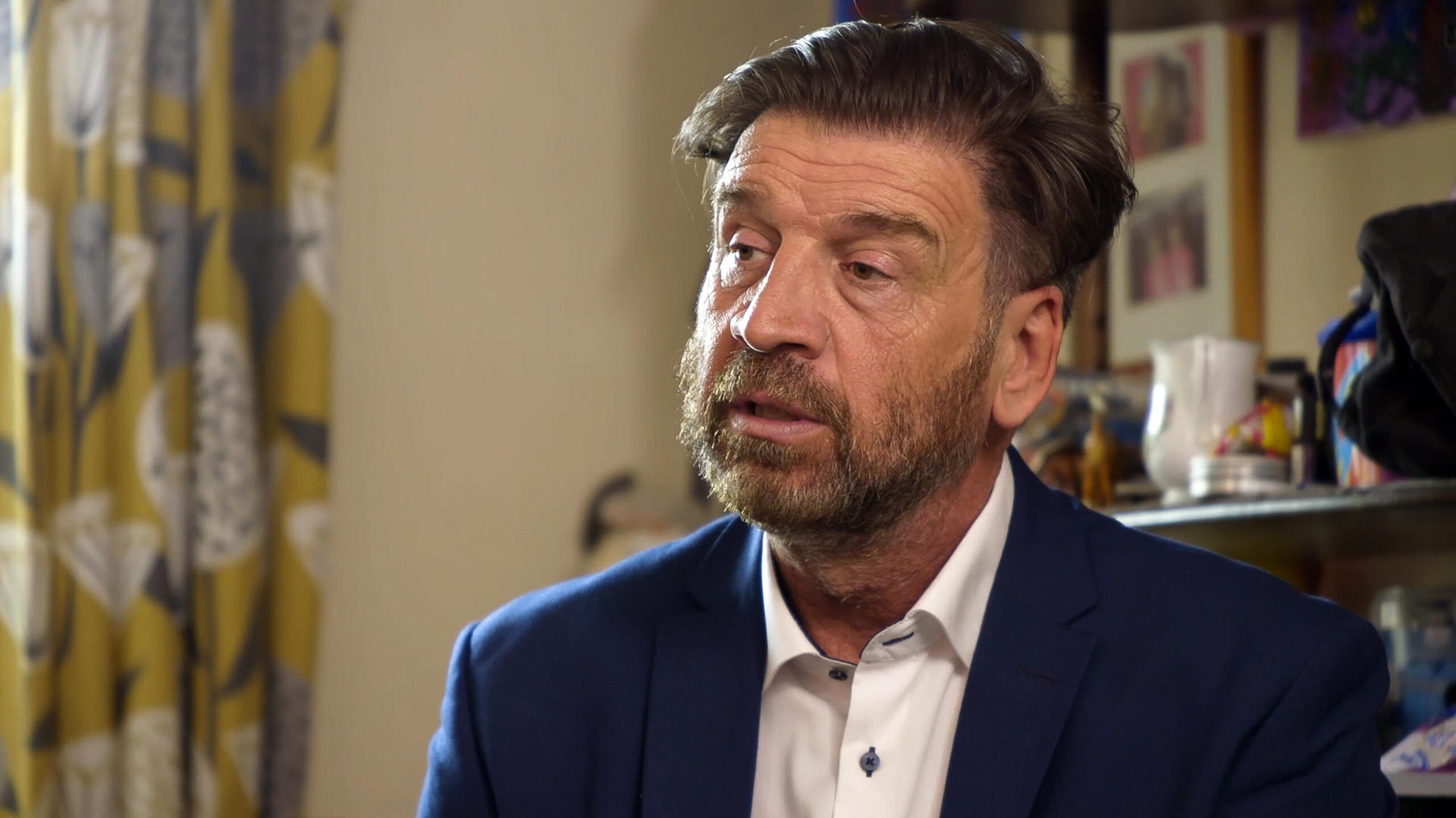 Nick Knowles wearing a suit in Big House Clearout