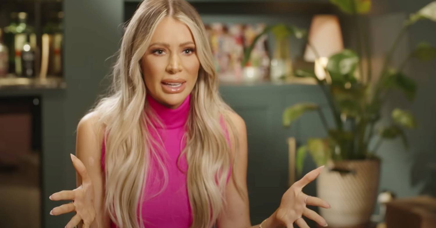 Olivia Attwood holds her hands open