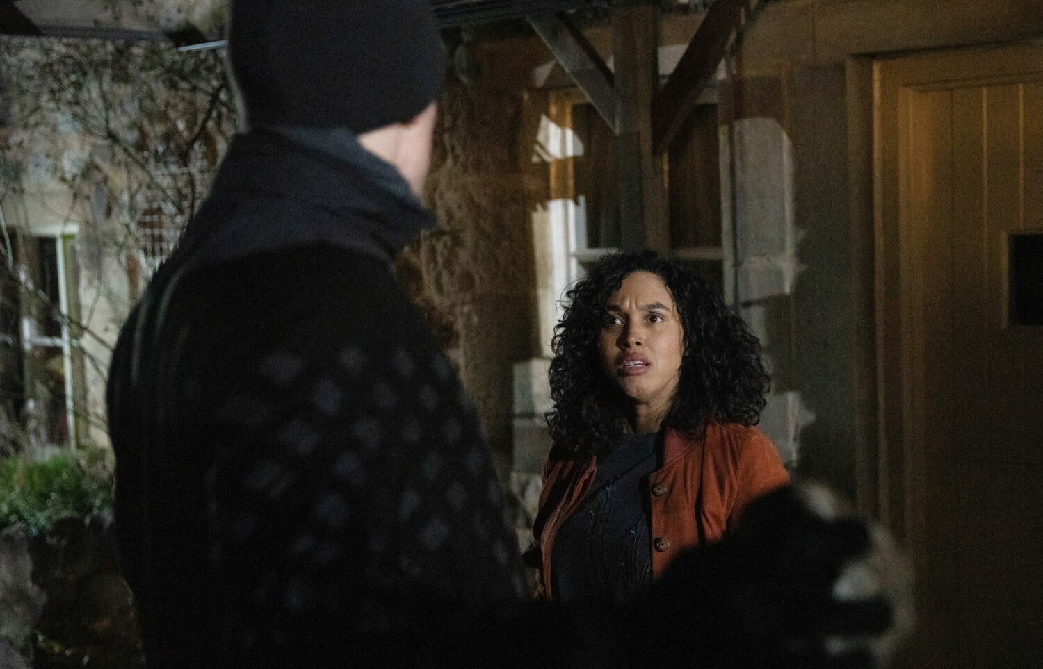 Callum is holding a brick up to Suzy