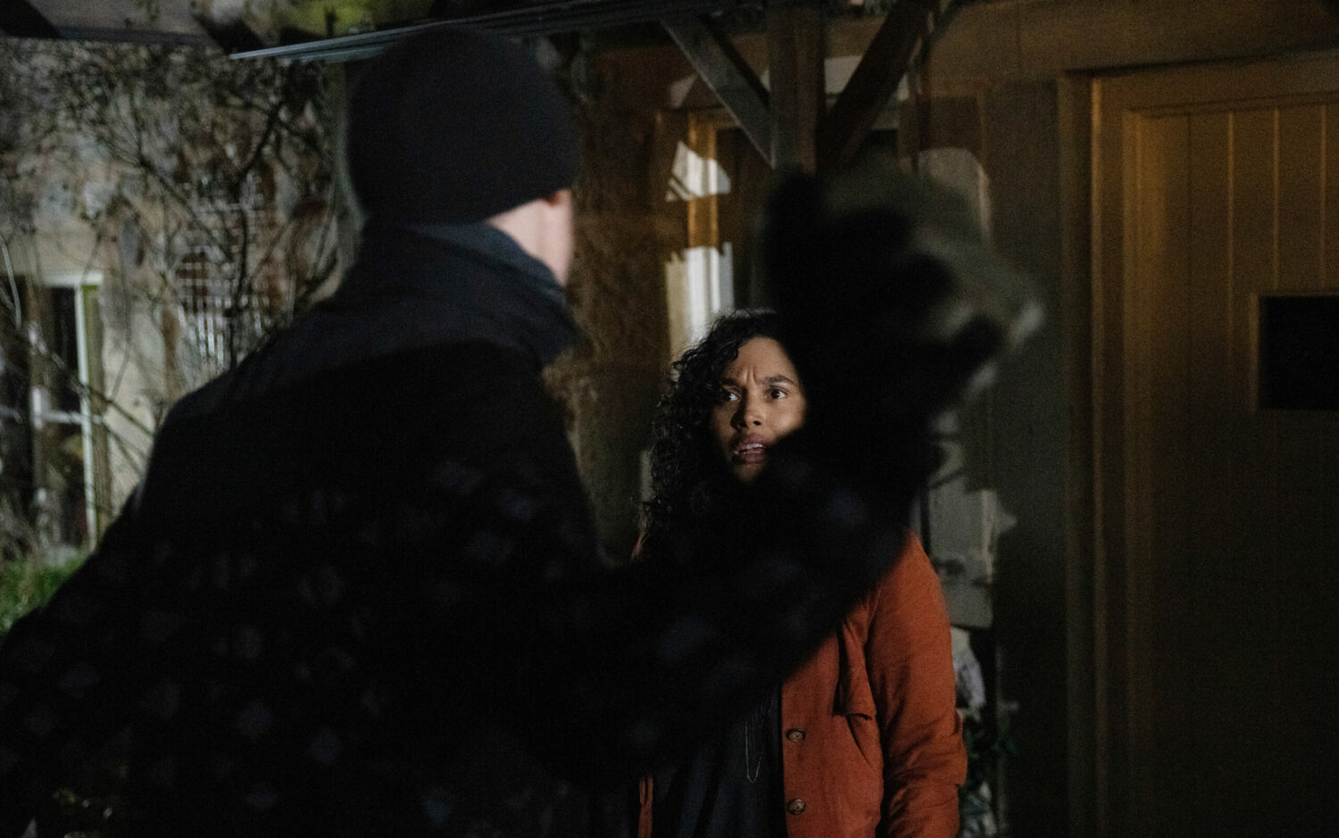 Callum is holding a brick up to Suzy