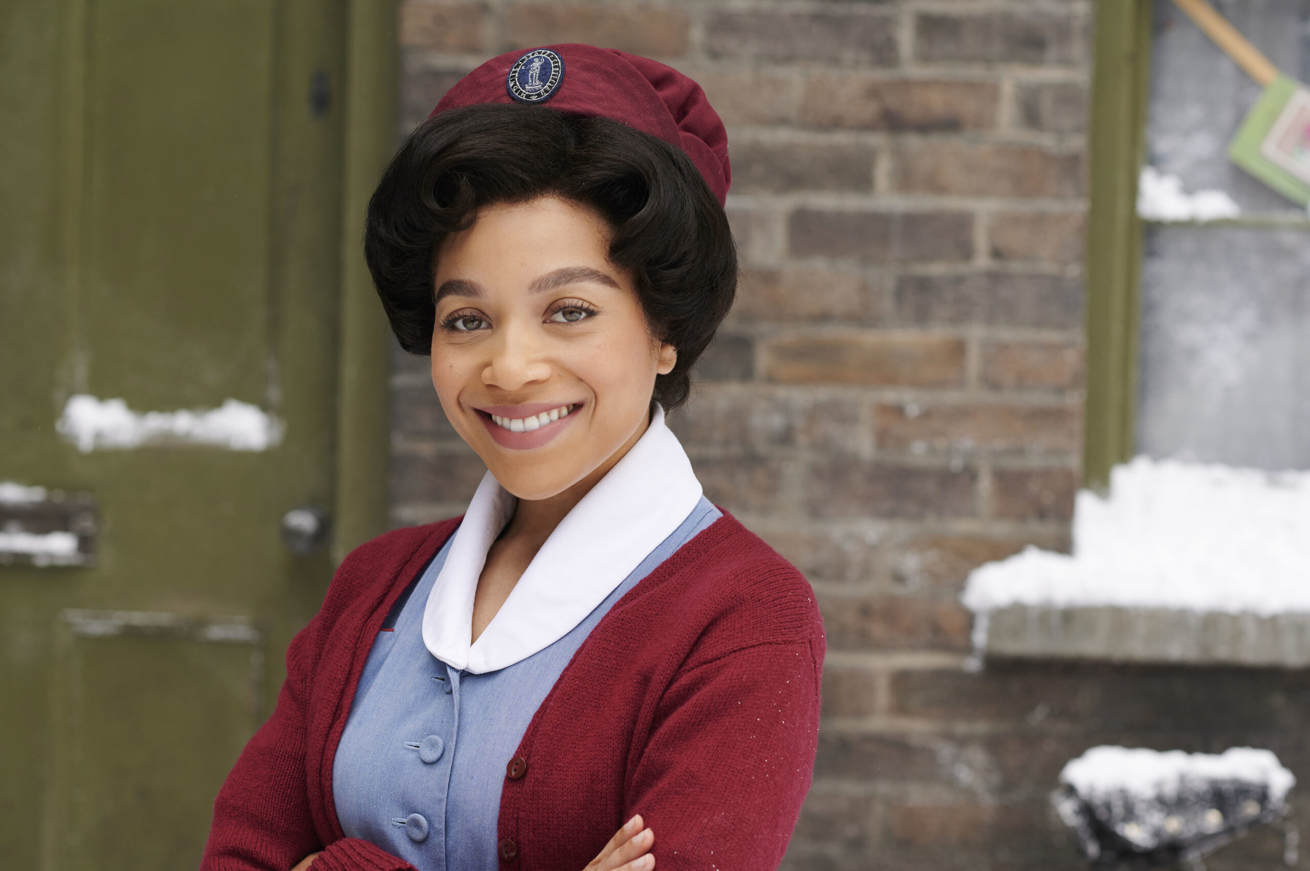 Lucille smiles outside in Call the Midwife