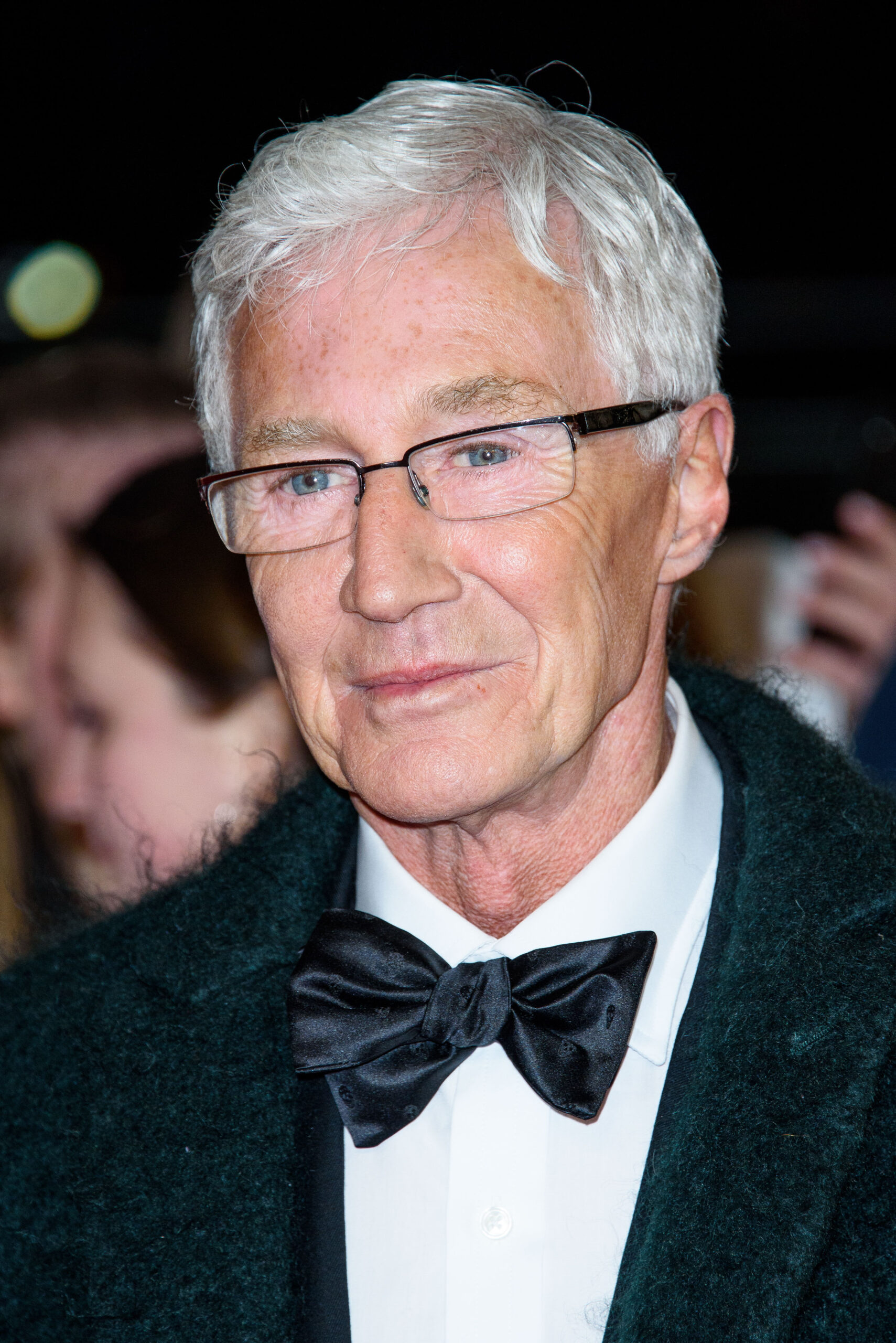 Paul O'Grady posing on the red carpet 