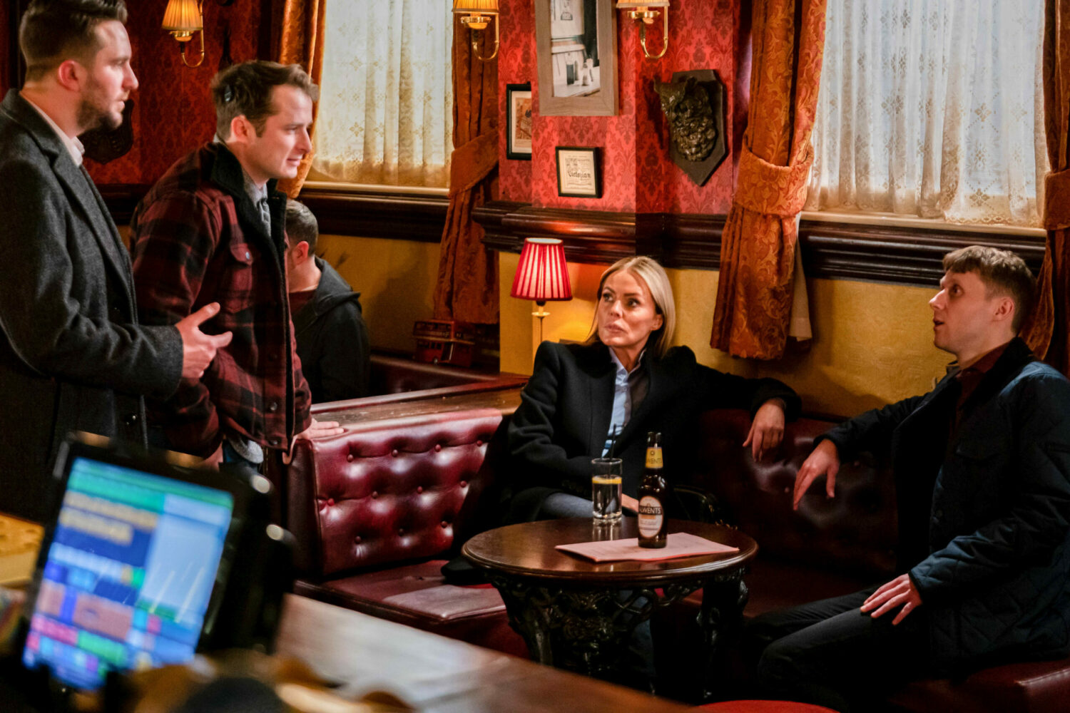Jay and Emma look up as Ben and Callum talk to them on EastEnders