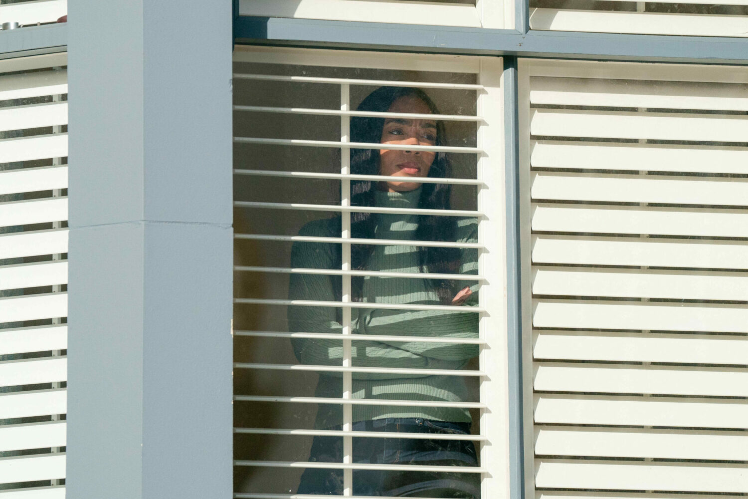 Chelsea is looking out of her window