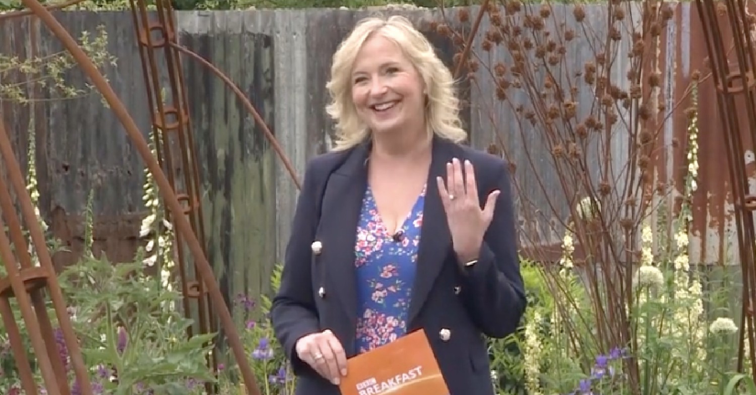 Carol Kirkwood smiling and showing her engagement ring on BBC Breakfast