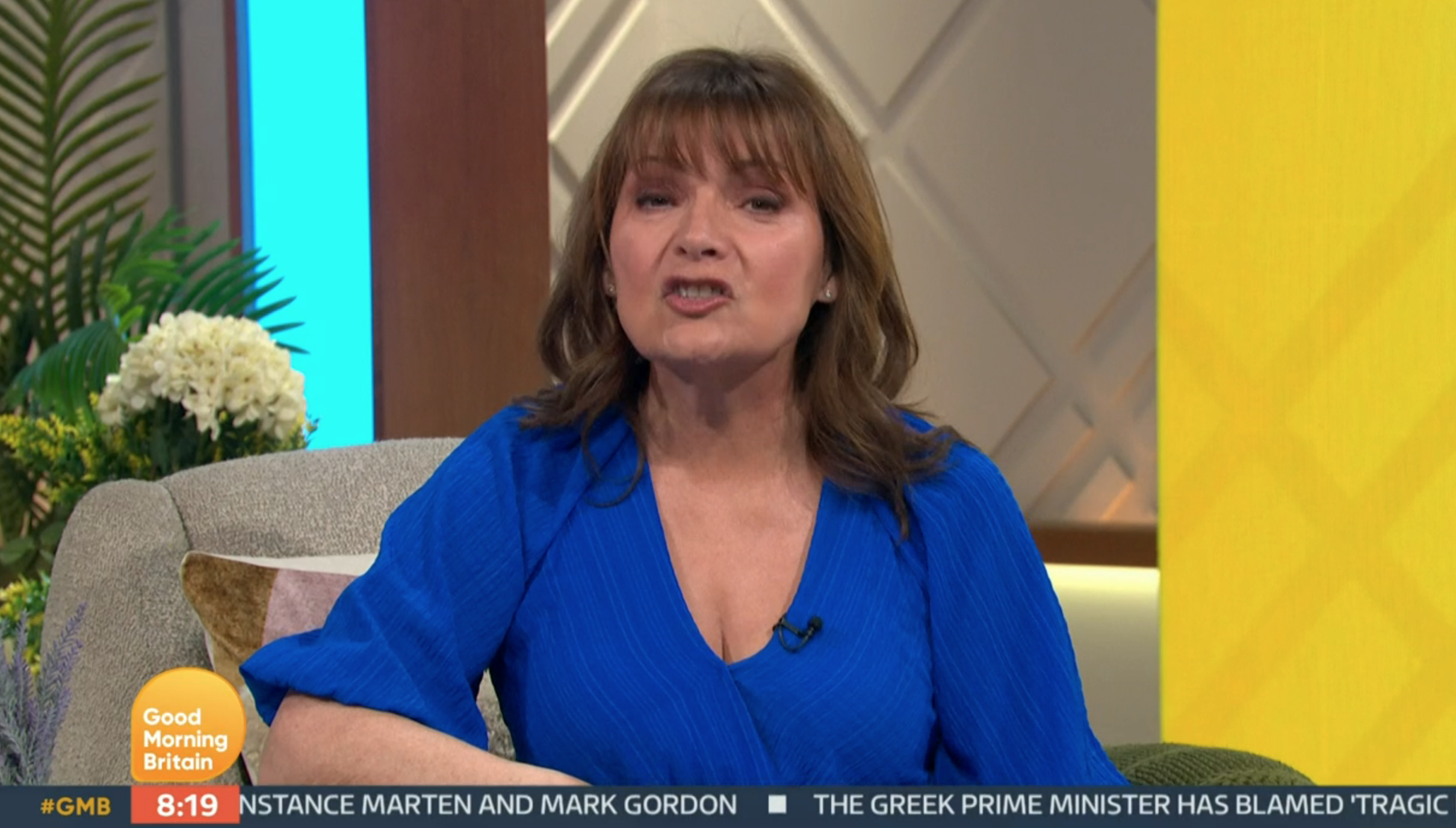 Lorraine Kelly presenting her show wearing blue