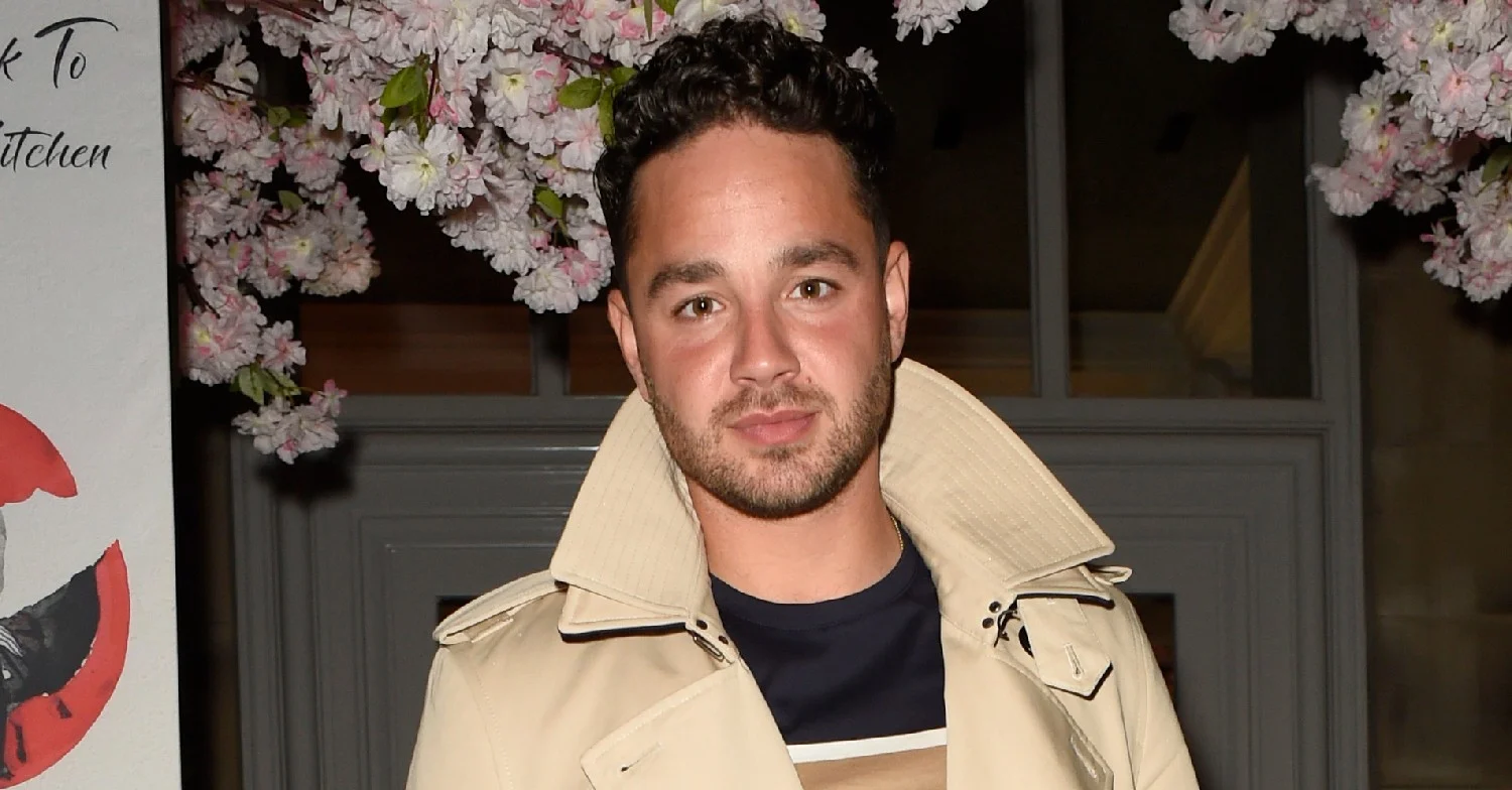 Adam Thomas posing for the camera 