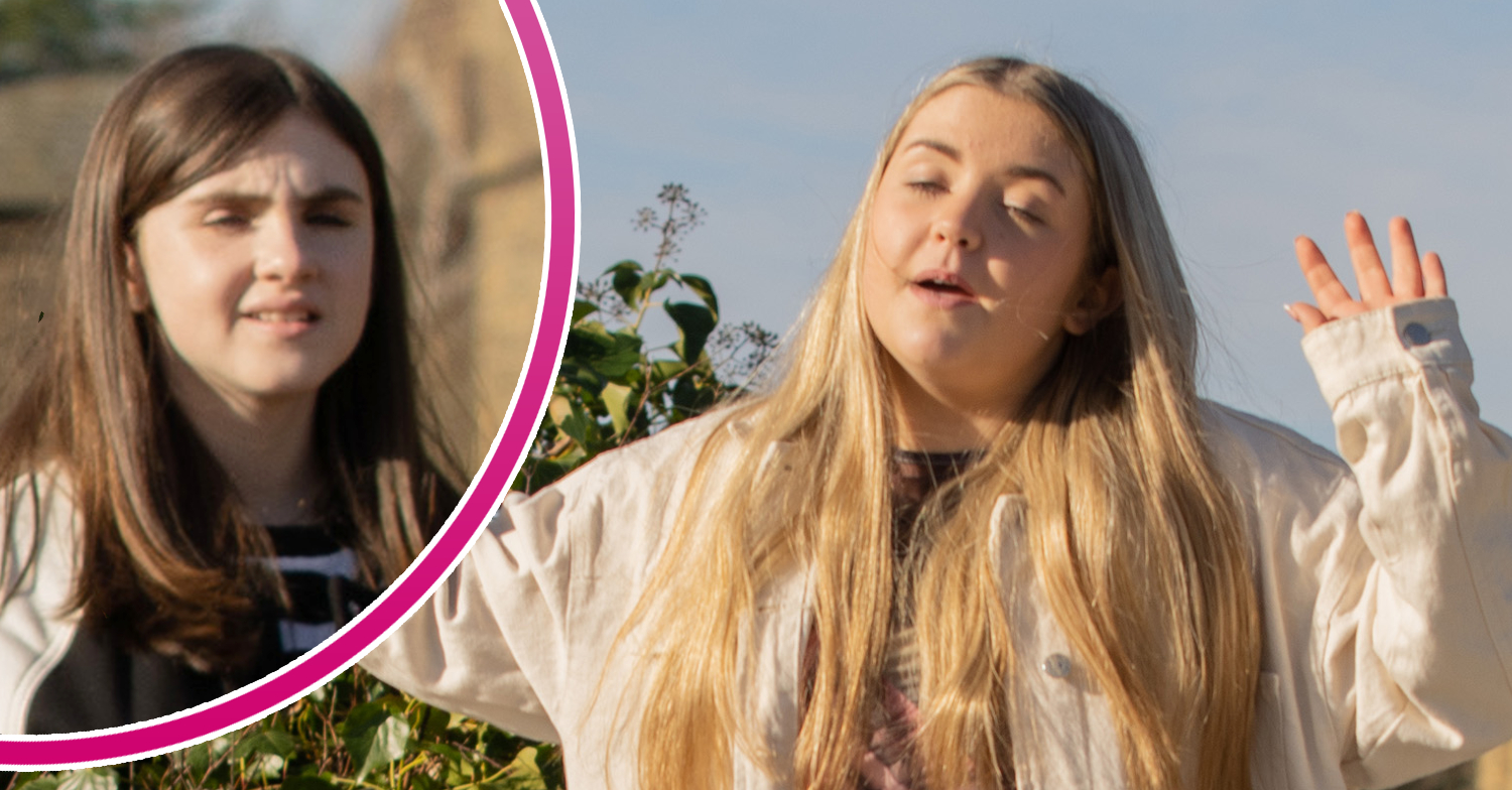 Emmerdale's Cathy has her eyes closed with her hands in the air and, in a bubble, April is looking concerned