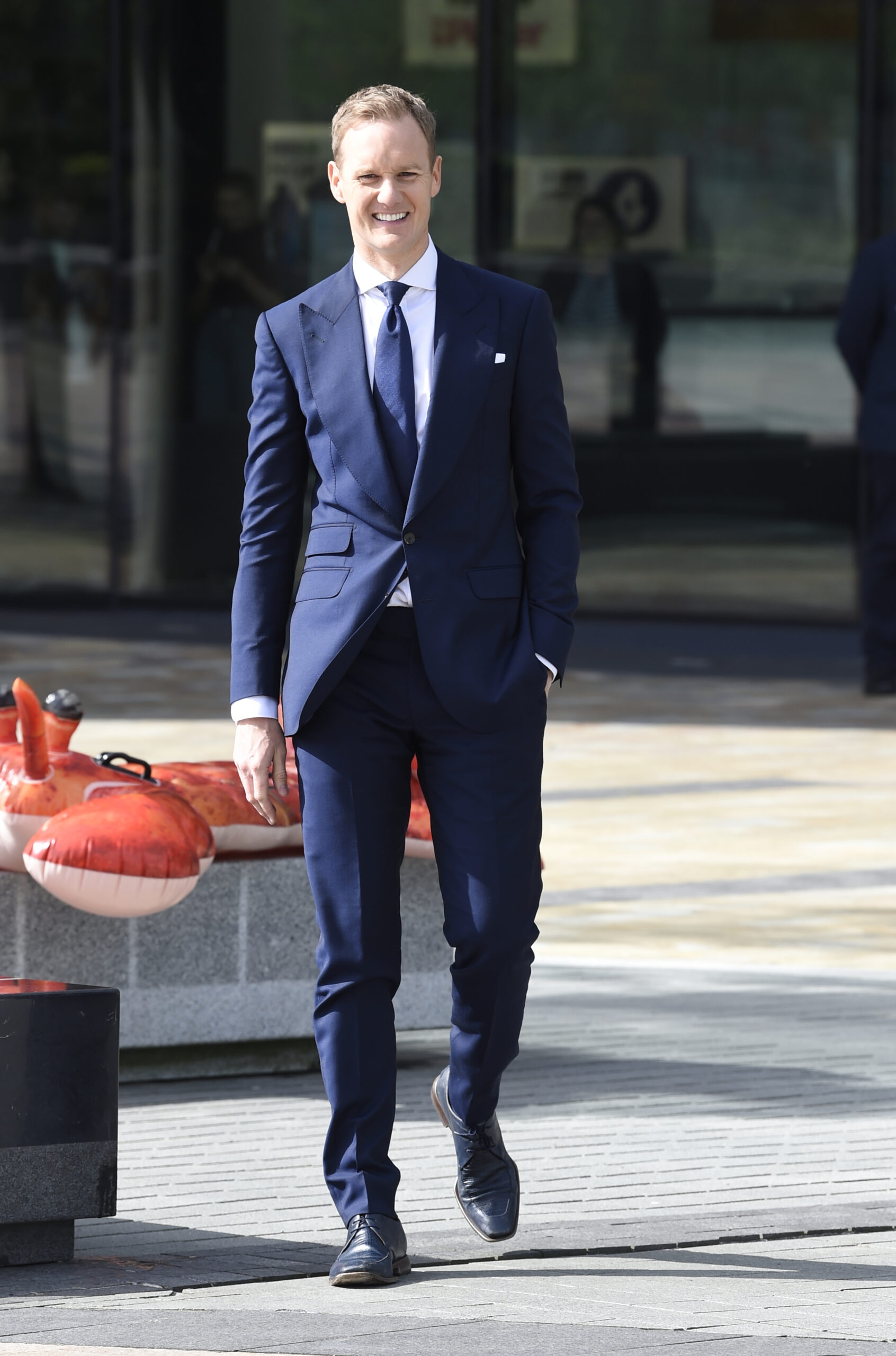Dan Walker smiles outside BBC studios
