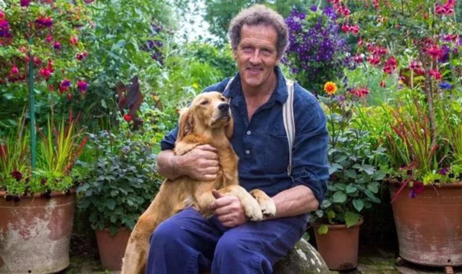 Monty Don smiling with dog