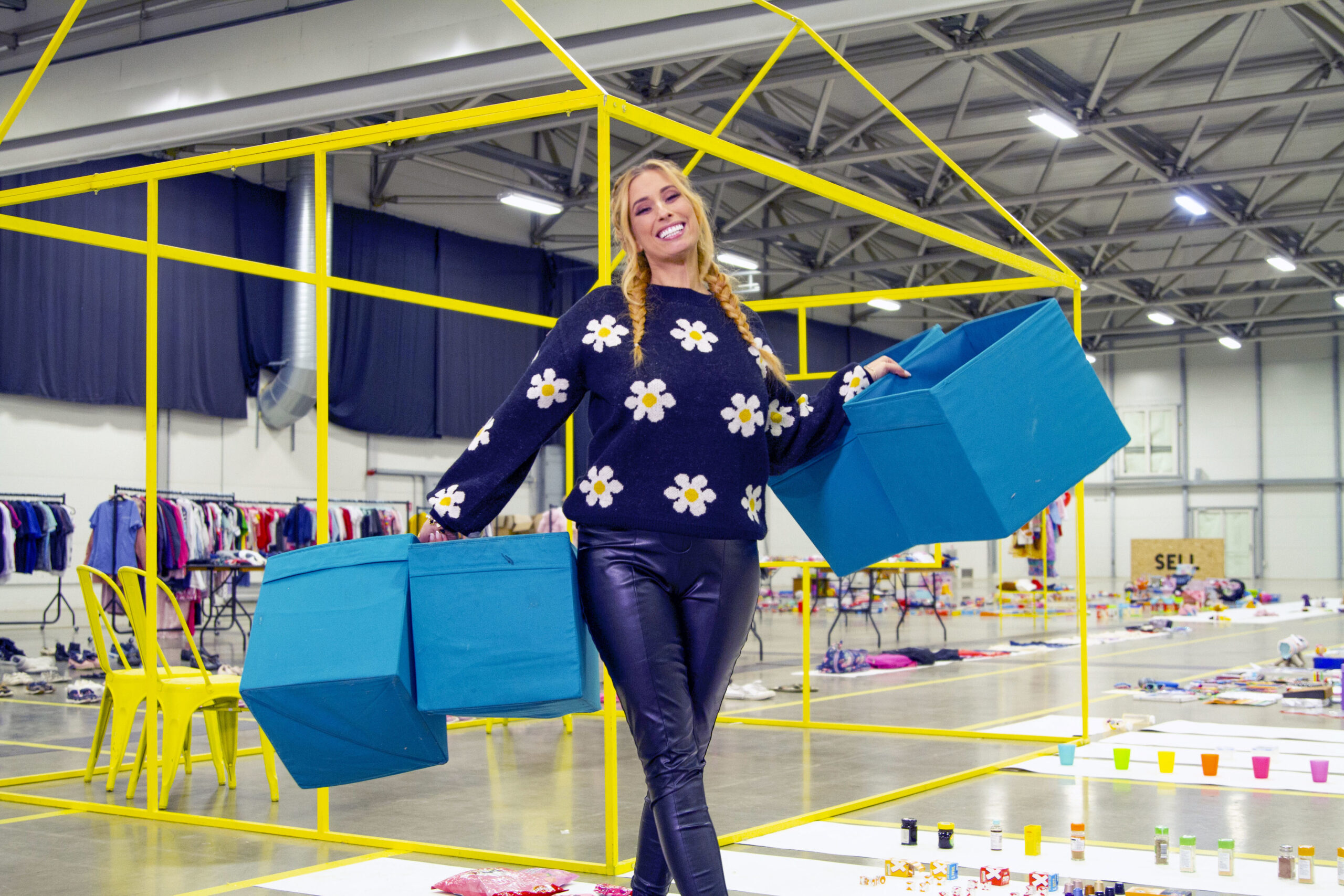 Stacey Solomon holding storage boxes in Sort Your Life Out