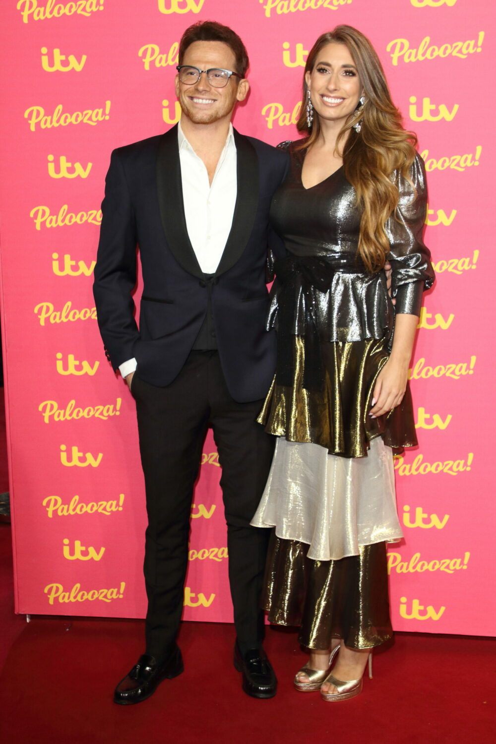 Joe Swash and Stacey Solomon smile together on the red carpet at the ITV Palooza 