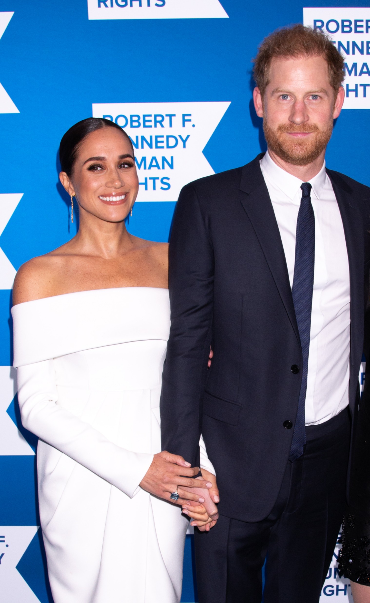 Harry and Meghan holding hands