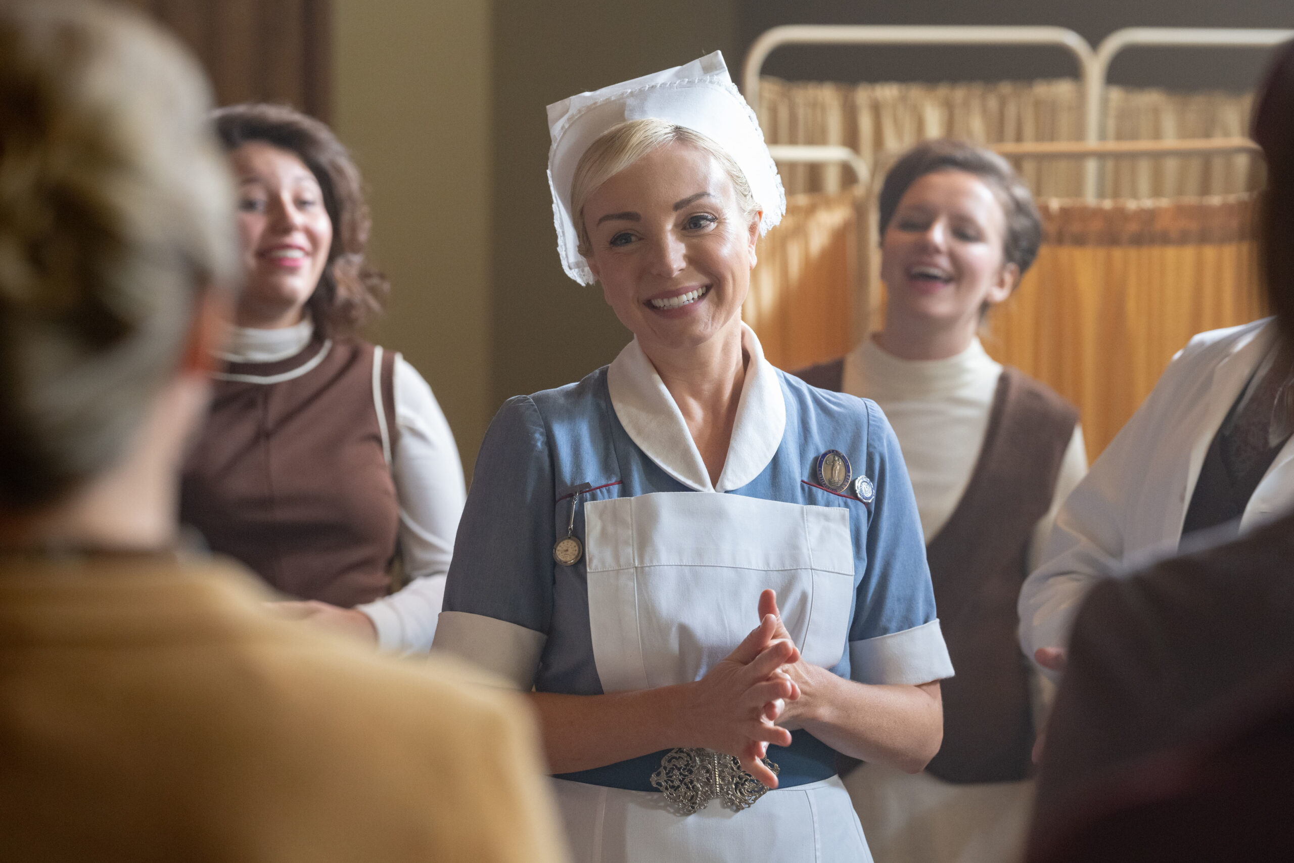 Trixie smiles on the ward in Call the Midwife