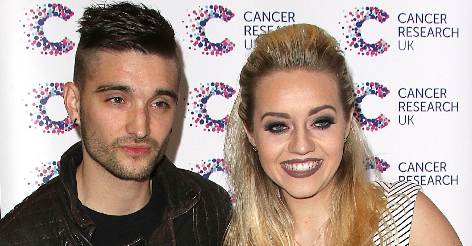 Tom and Kelsey Parker smiling at an event 