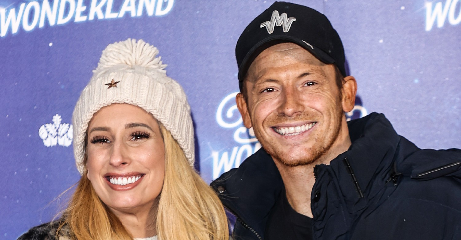 Stacey Solomon and Joe Swash smiling at an event
