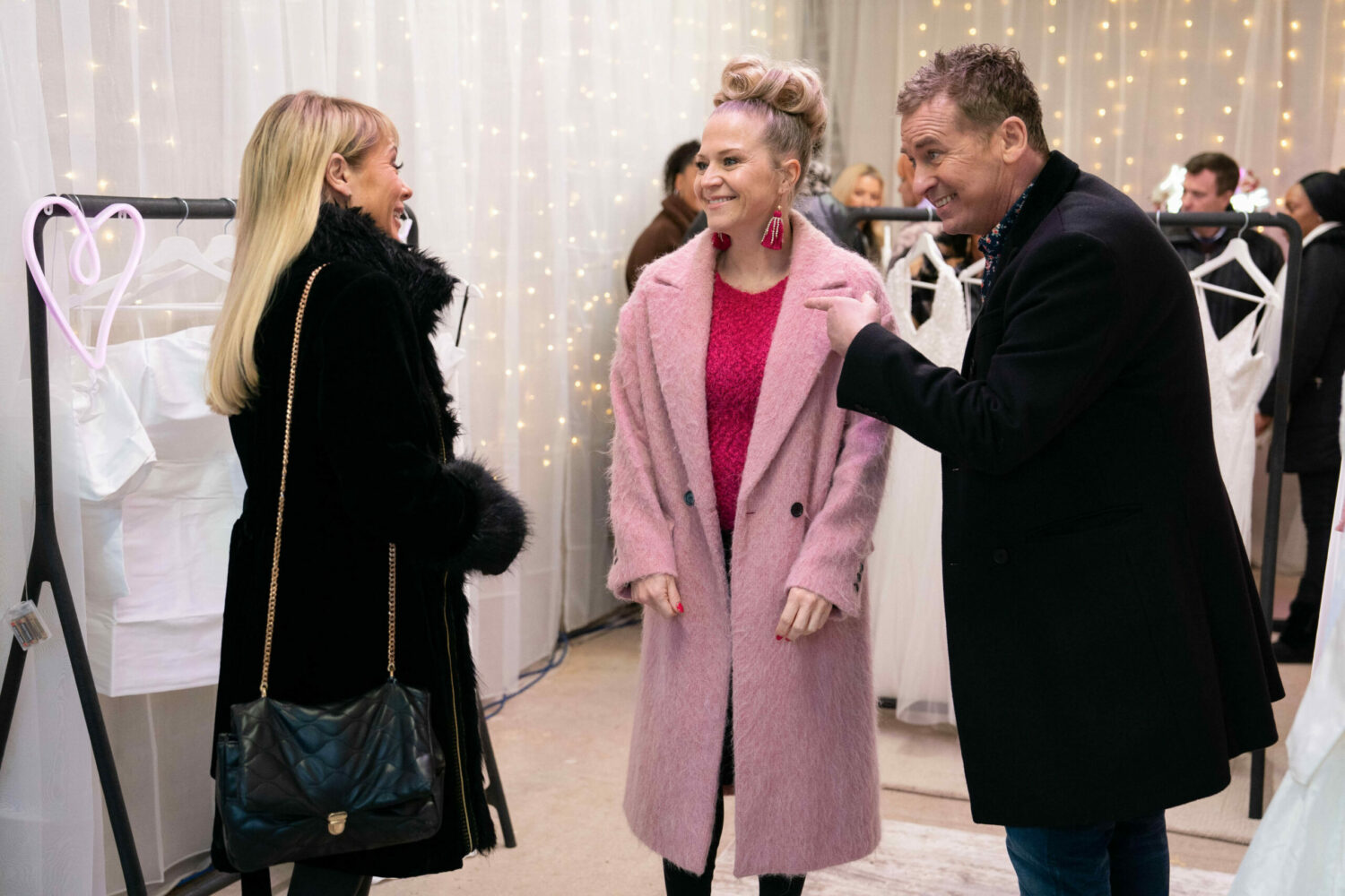 Sharon Watts and Linda Carter smile as Alfie smoozes them