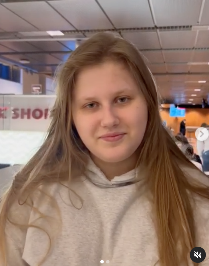 I am Madeleine McCann girl Julia Wandelt smiling at the airport