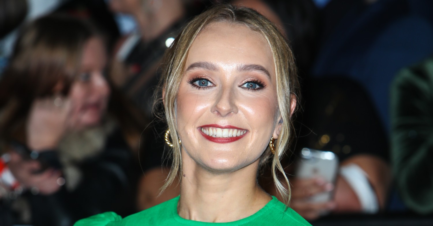 Rose Ayling-Ellis smiling on a red carpet 