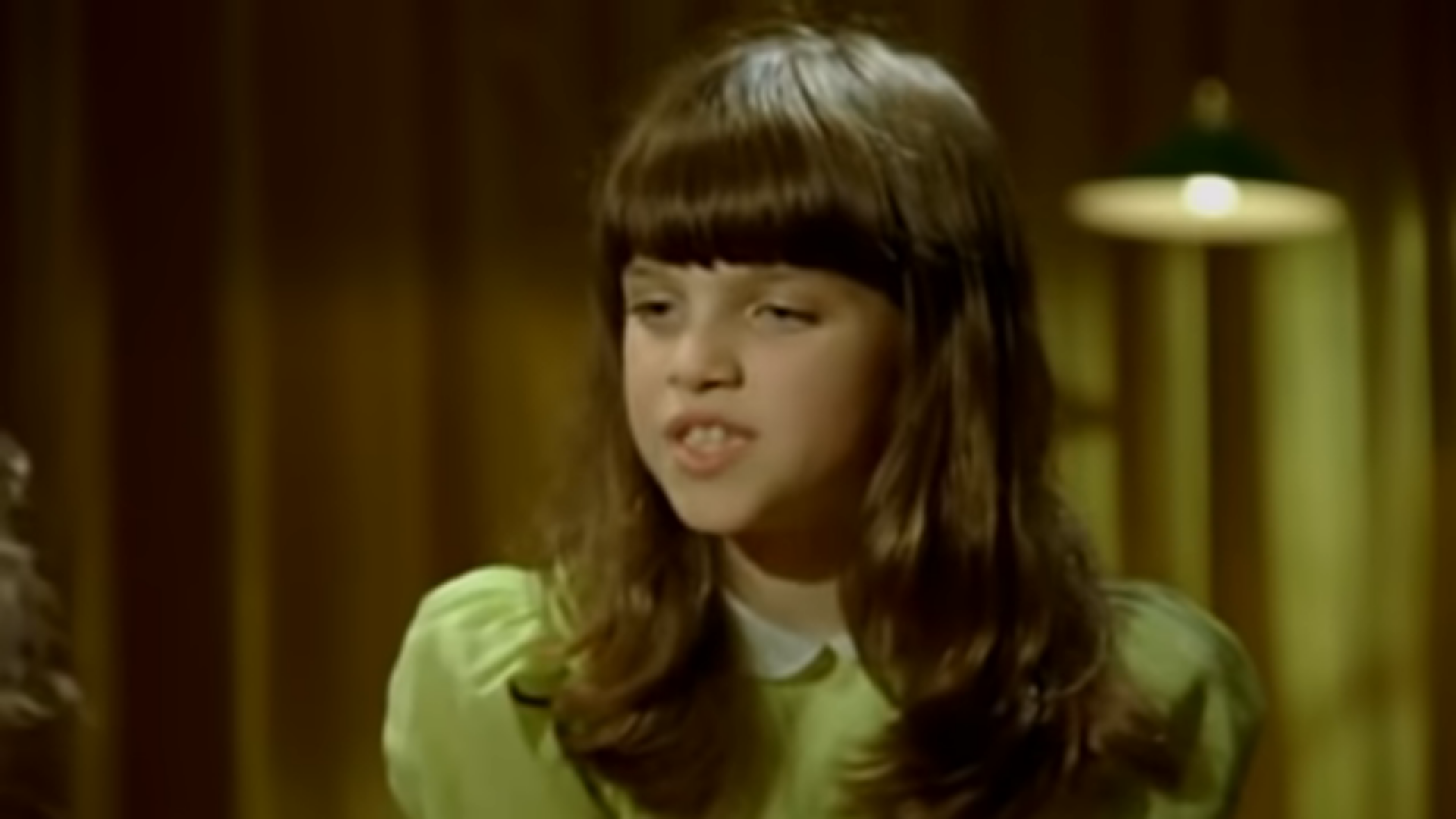 Mae Muller frowns in Mika's Grace Kelly music video