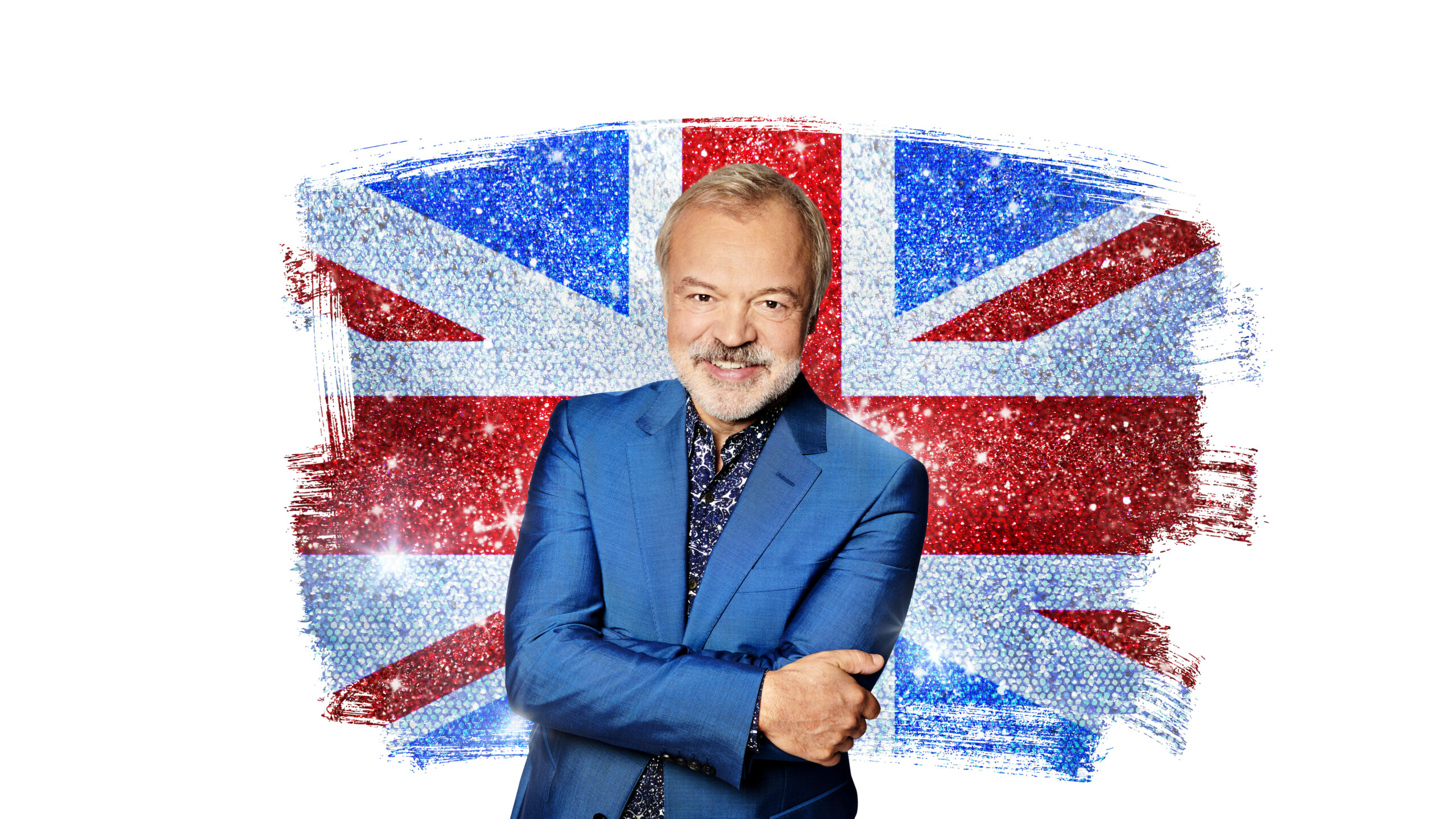 Graham Norton poses with the Union Jack behind him