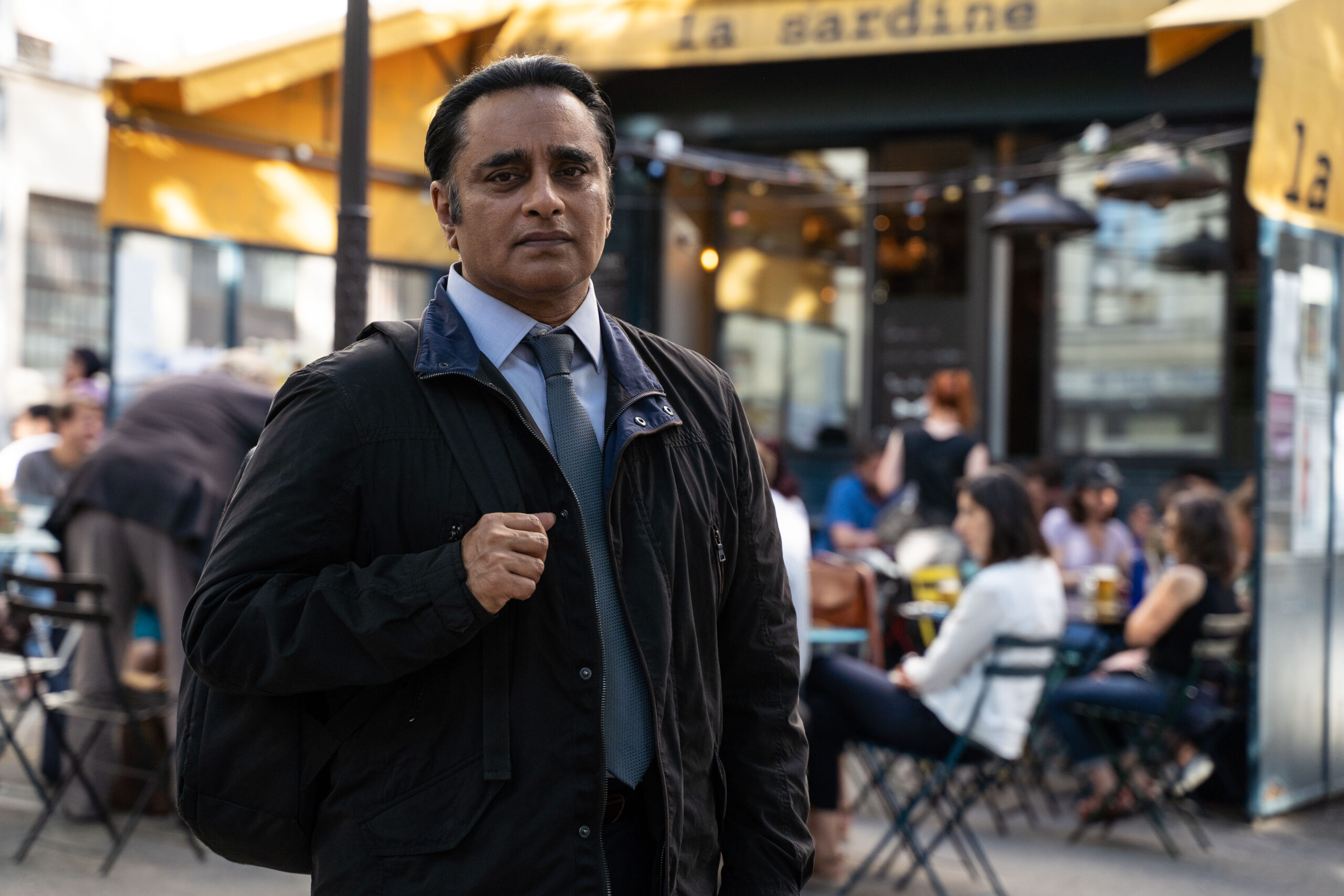 Sanjeev Bhaskar with his backpack as Sunny in Unforgotten