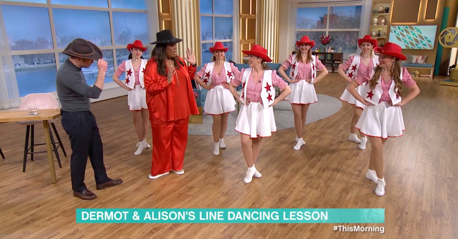 Dermot tips his hat alongside dancers on This Morning today
