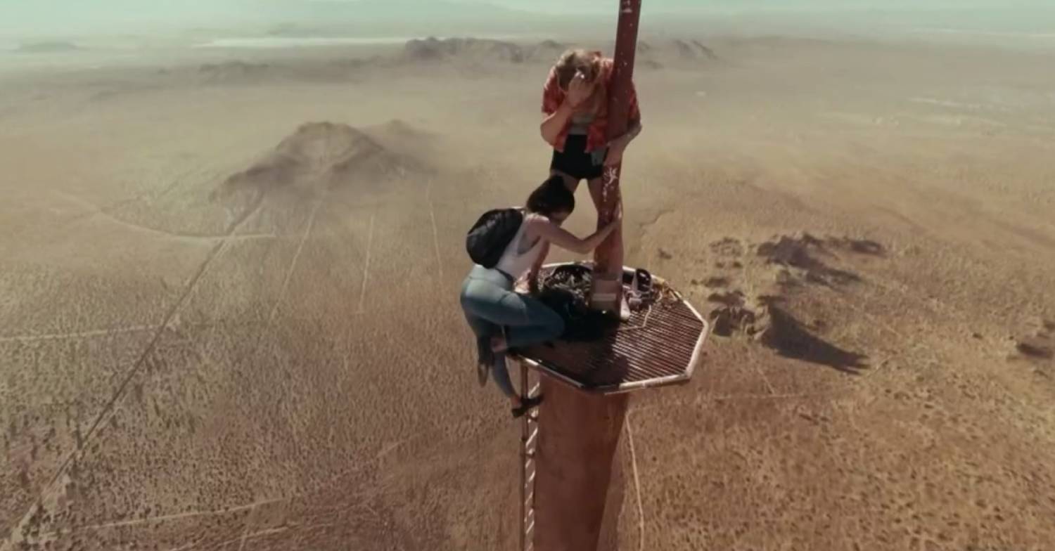 Fall characters on top of remote radio tower