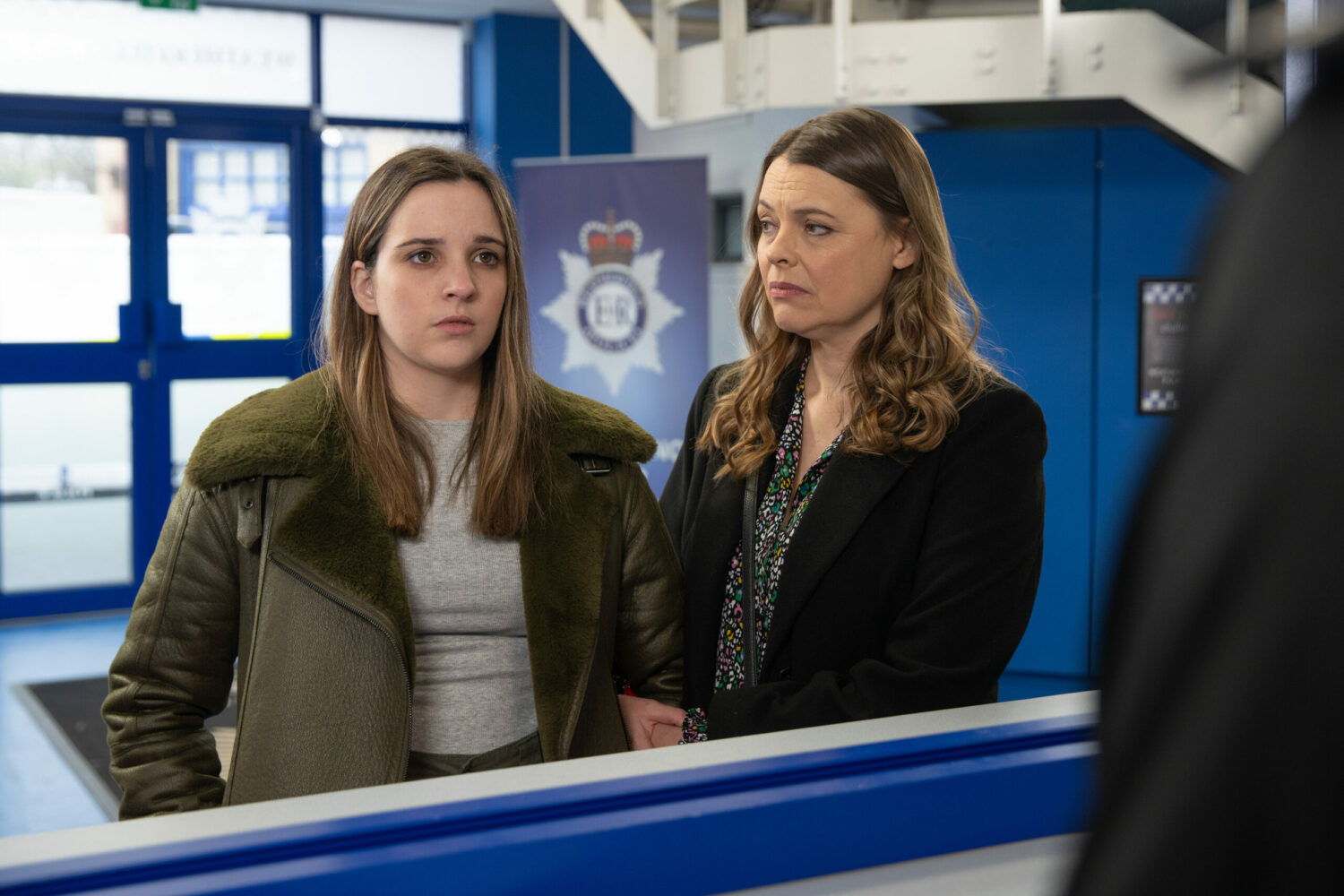 Coronation Street: Amy is supported by Tracy as she reports Aaron at the police station