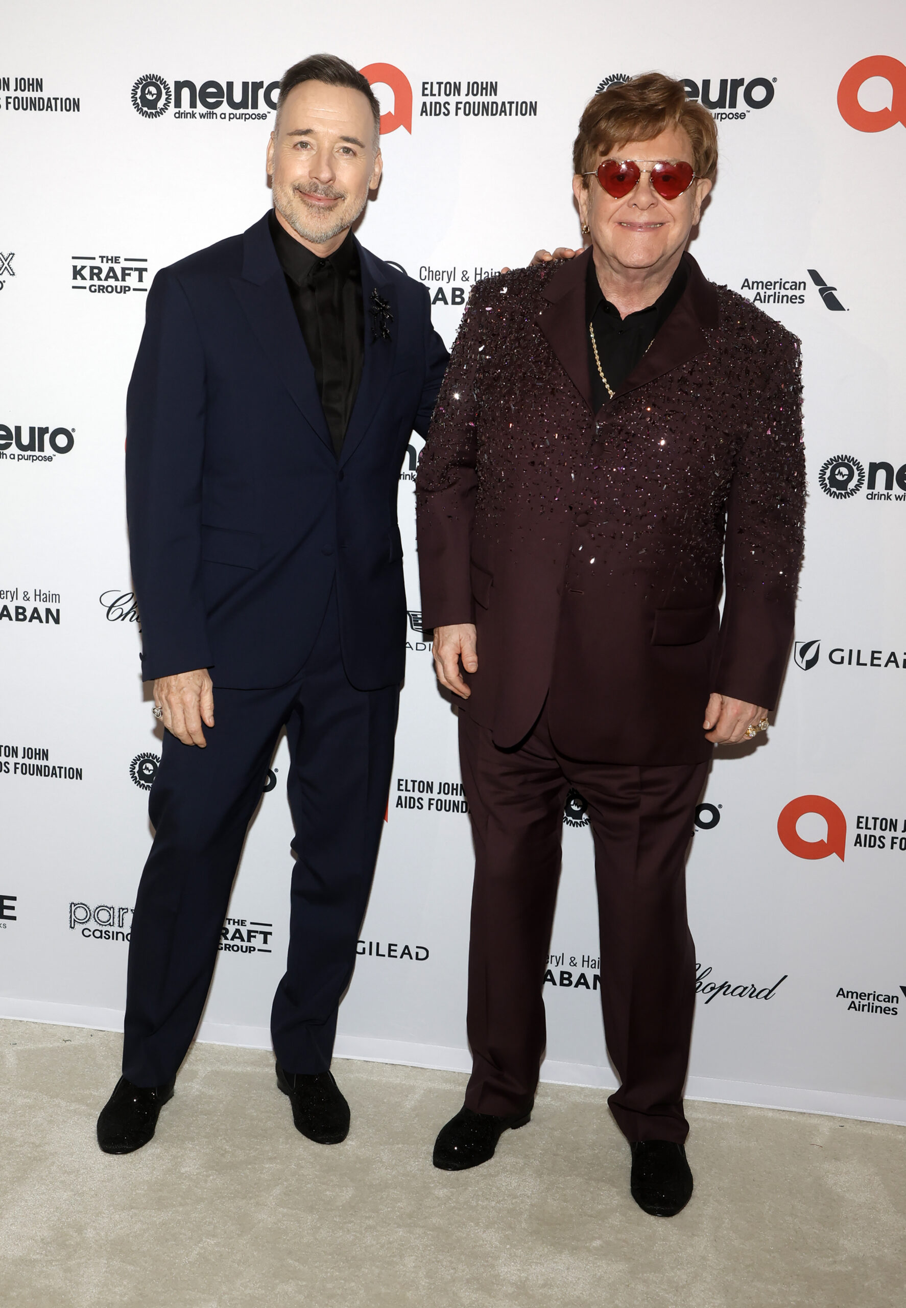 David Furnish and Elton John pose on red carpet in 2023