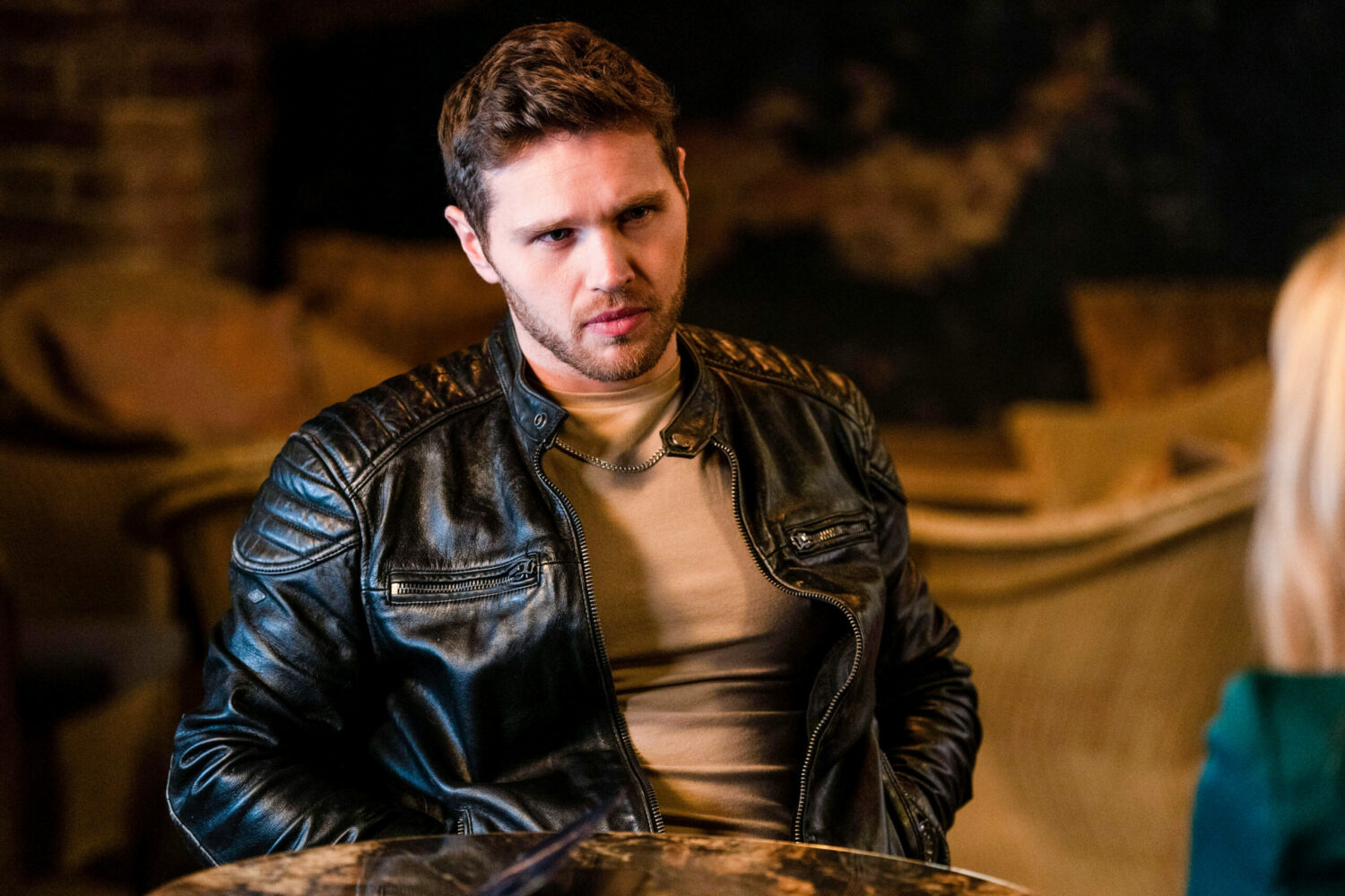 Keanu in EastEnders looks deep in thought as Sam talks to him