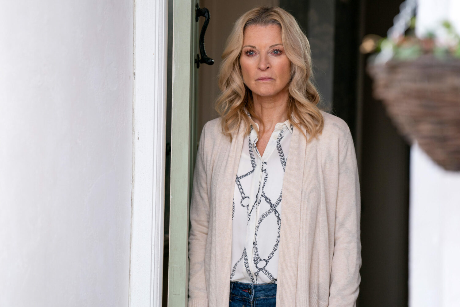 EastEnders Phil Mitchell lover Kathy Beale is standing in the doorway looking miserable