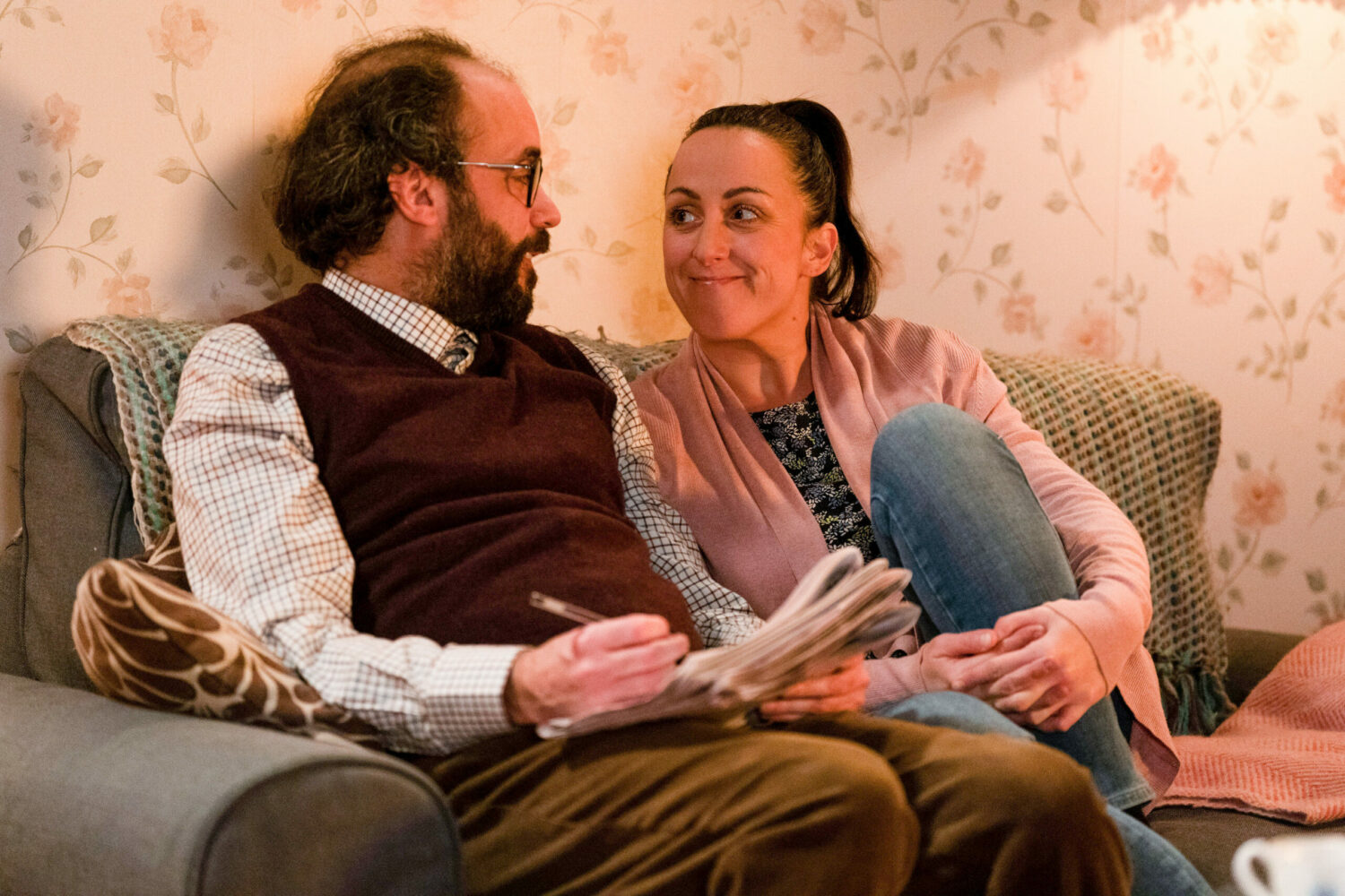 Reiss and Sonia in EastEnders smile at each other