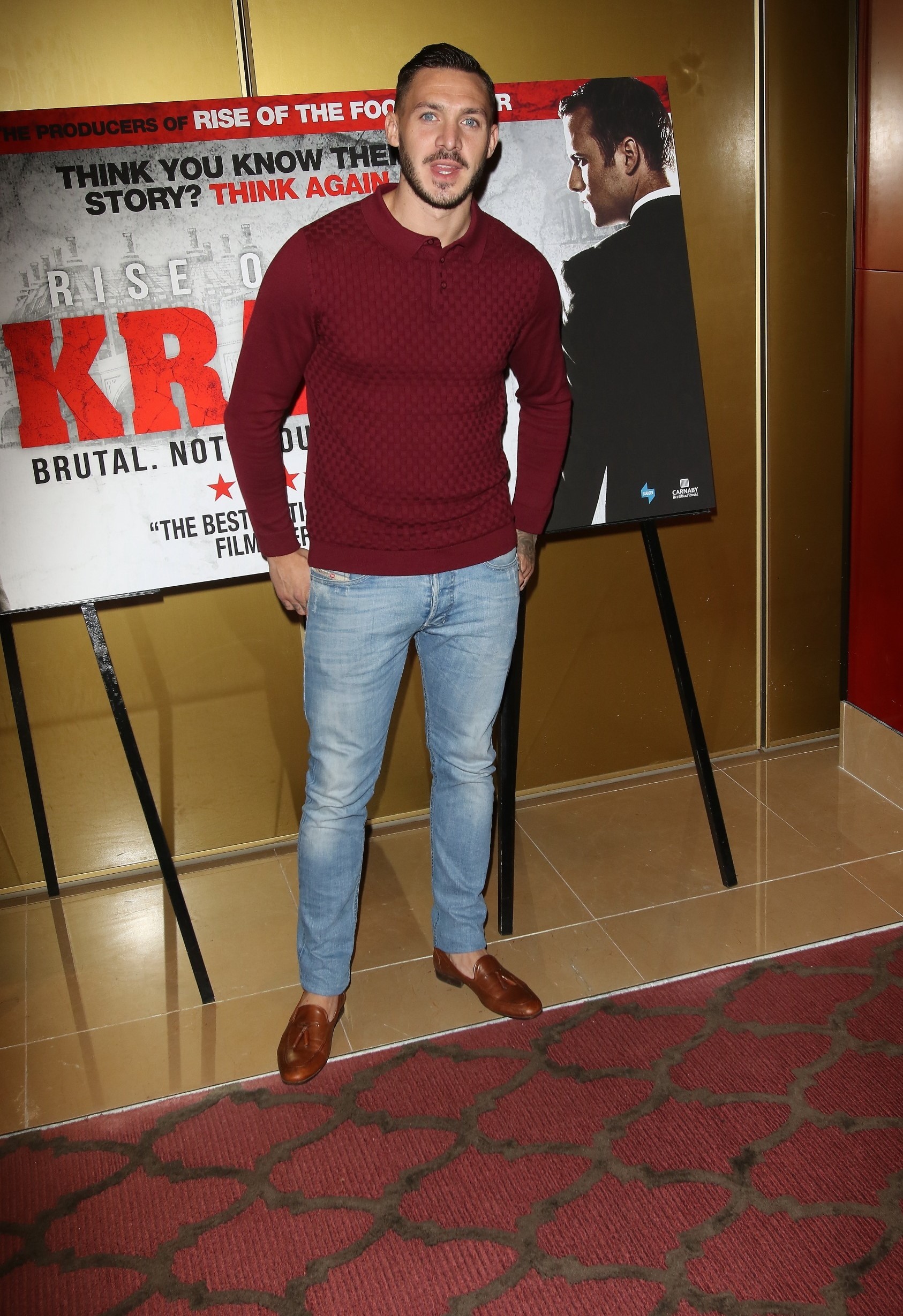 Kirk Norcross posing and smiling at event