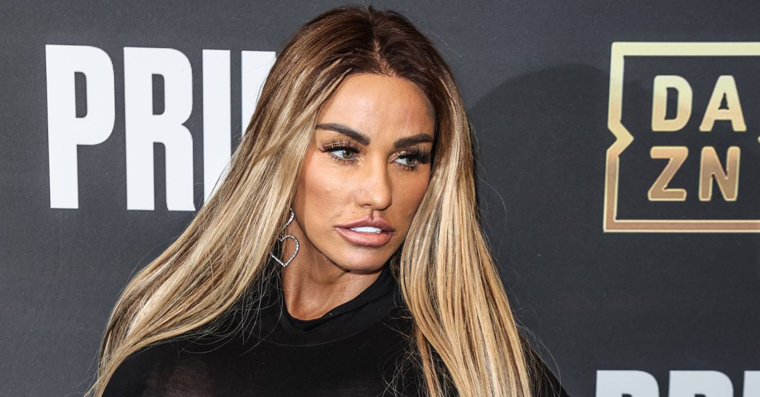 Katie Price looks to her side