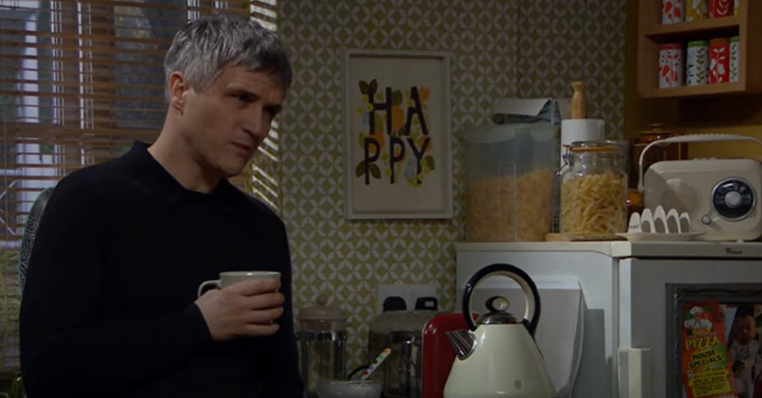 Emmerdale's Caleb is sipping a coffee