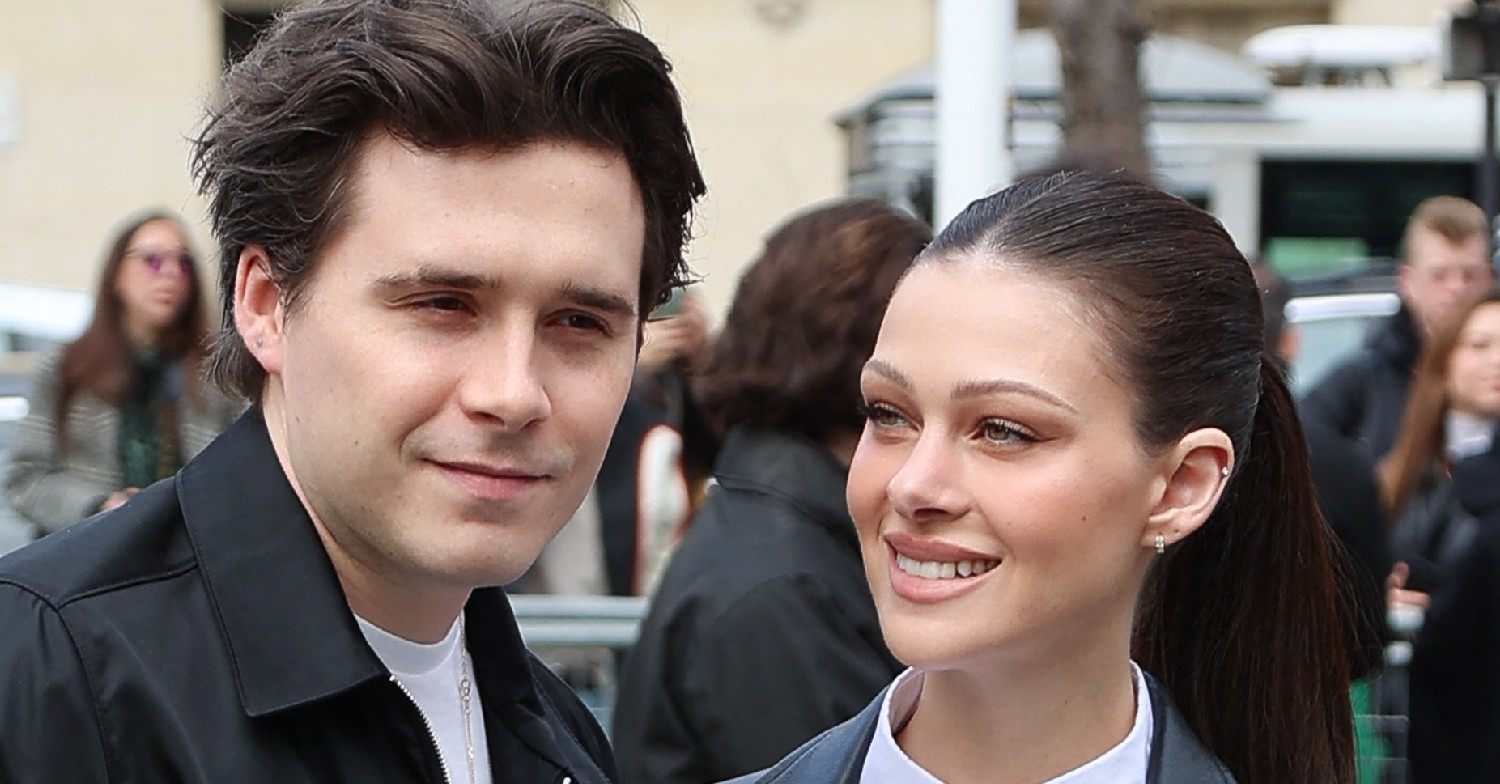 Brooklyn Beckham smiling outside with Nicola Peltz