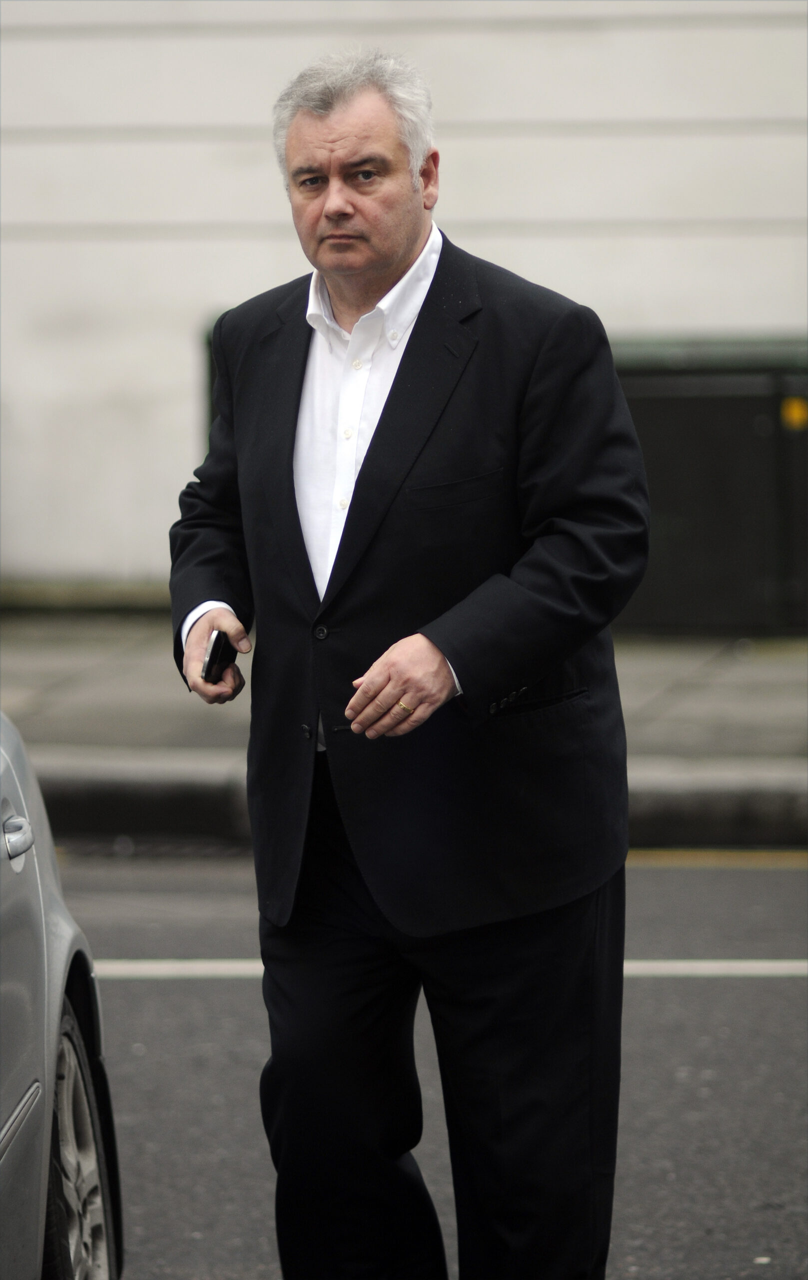 Eamonn Holmes wearing a black suit